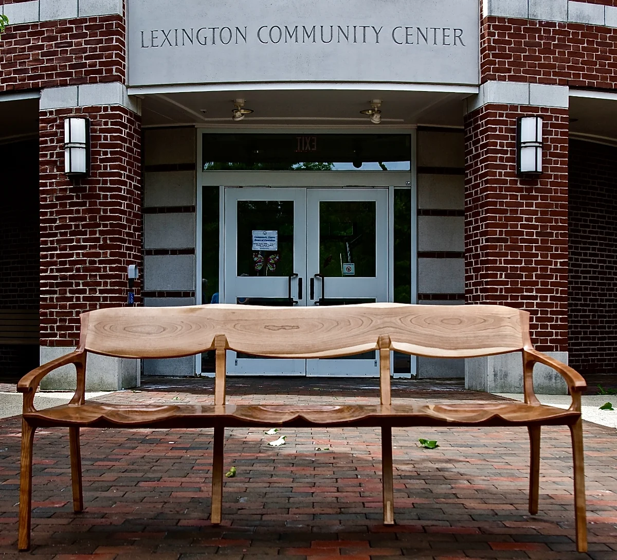 So I was approached to design a bench that the Lexington Woodworker's Guild would build and donate to the Lexington Community Center. The design is really an extended chair. The idea for the middle legs was stolen from the conoid chair that I built last year. A half dozen of us built it over the winter last year in the Woodworker's Guild shop, a real fun project.