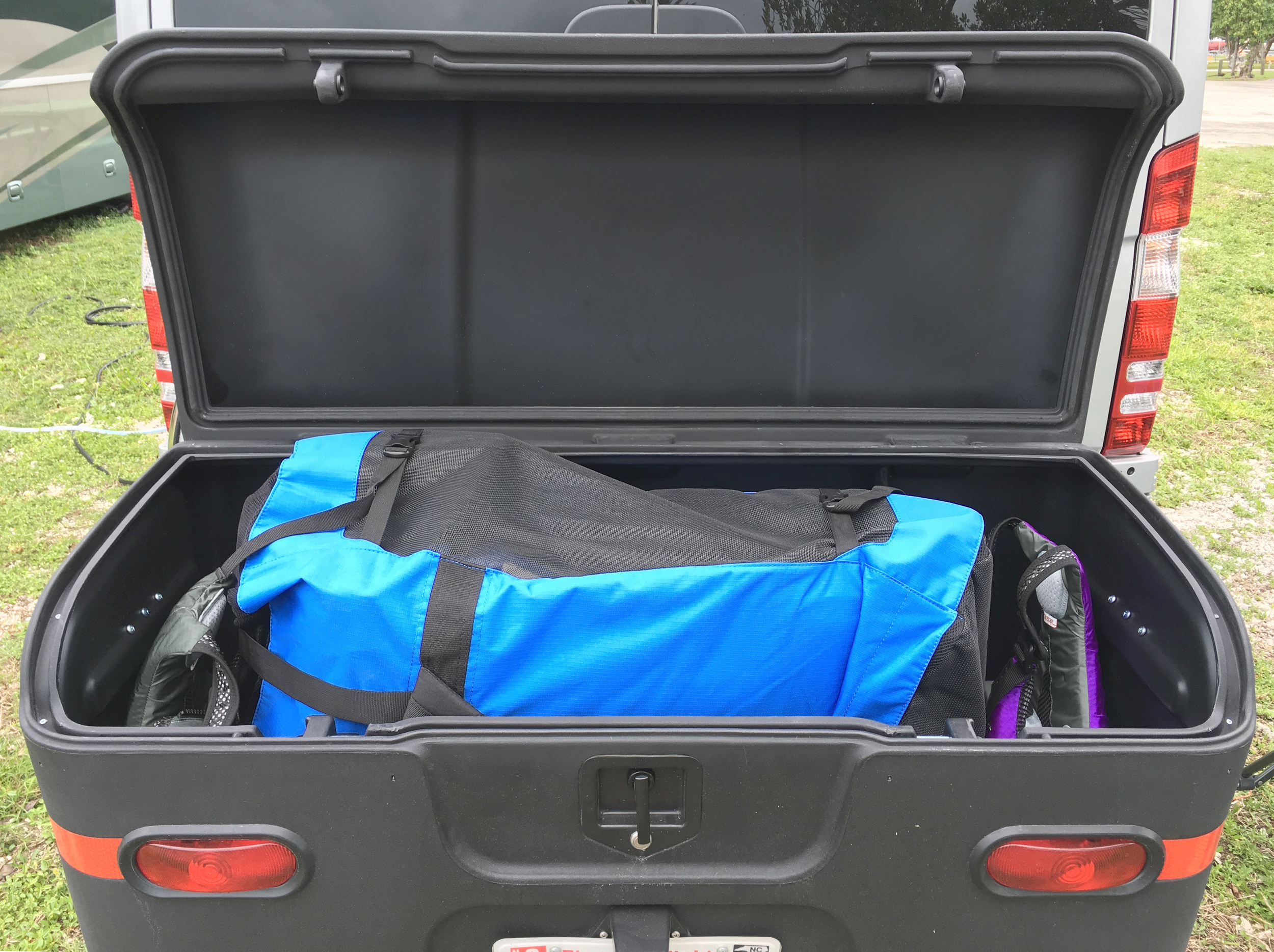The cargo box has more than enough space to hold the backpack with kayak/seats/pump, life vests, and other gear like a waterproof duffle bag for our camera and binoculars.