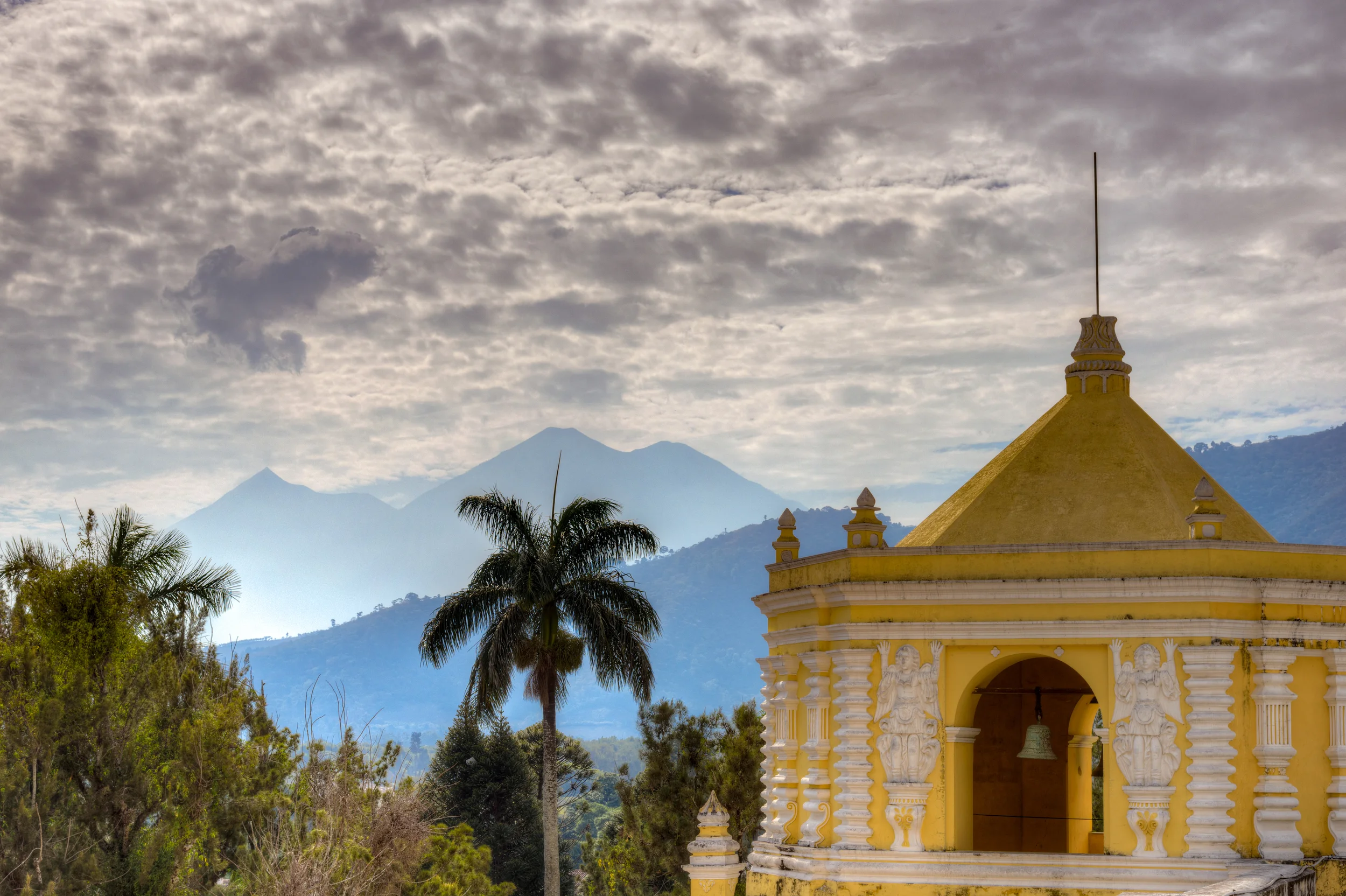 The next day, a quieter scene with the same volcano in the distance (far left peak)