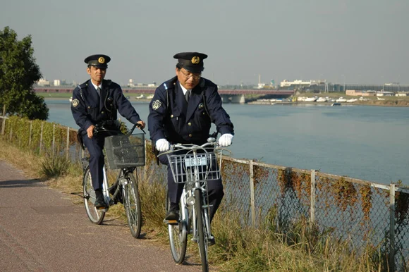 A pair of Omawari-san patrolling Tokyo