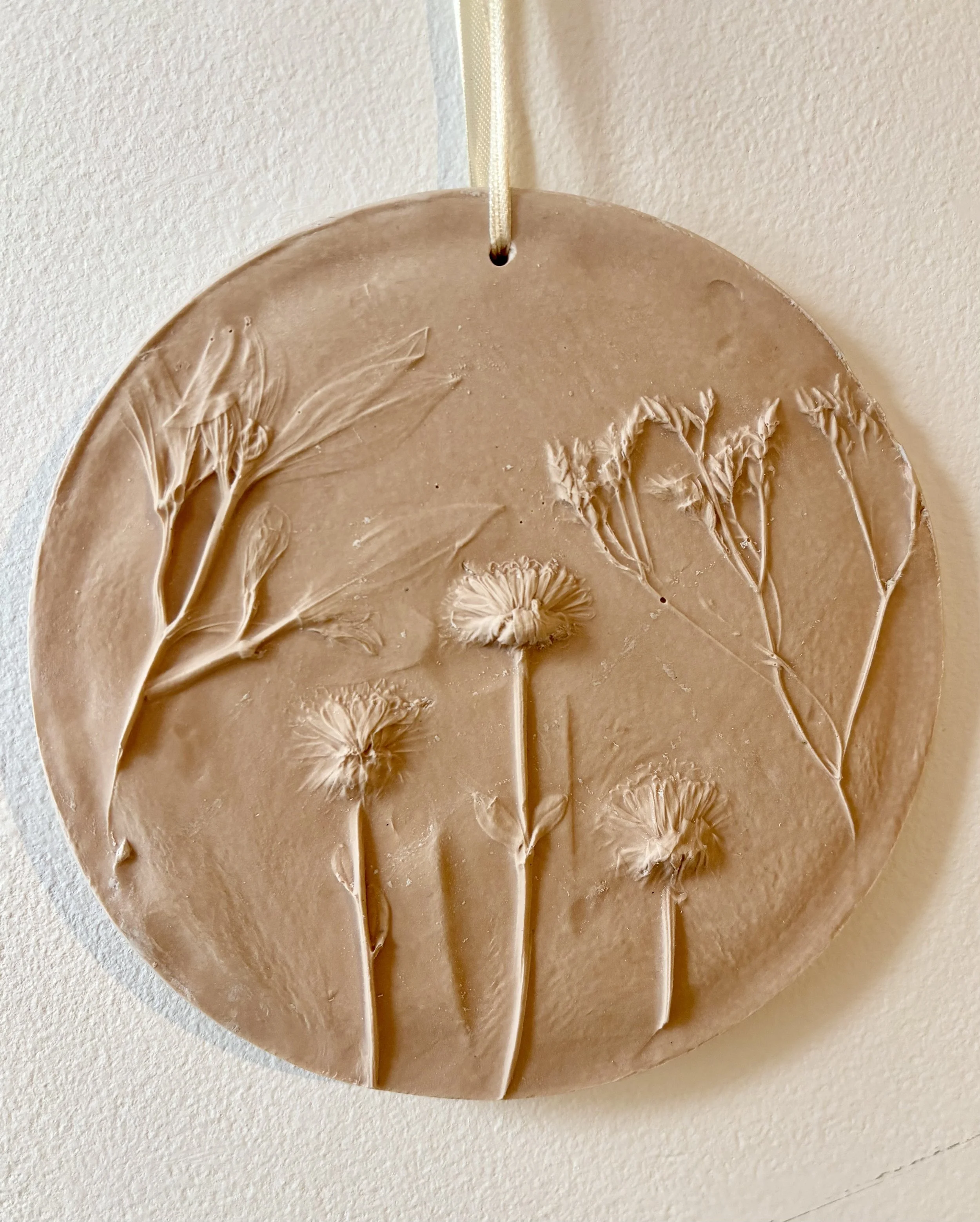 Close up of flower relief wall art made from jesmonite