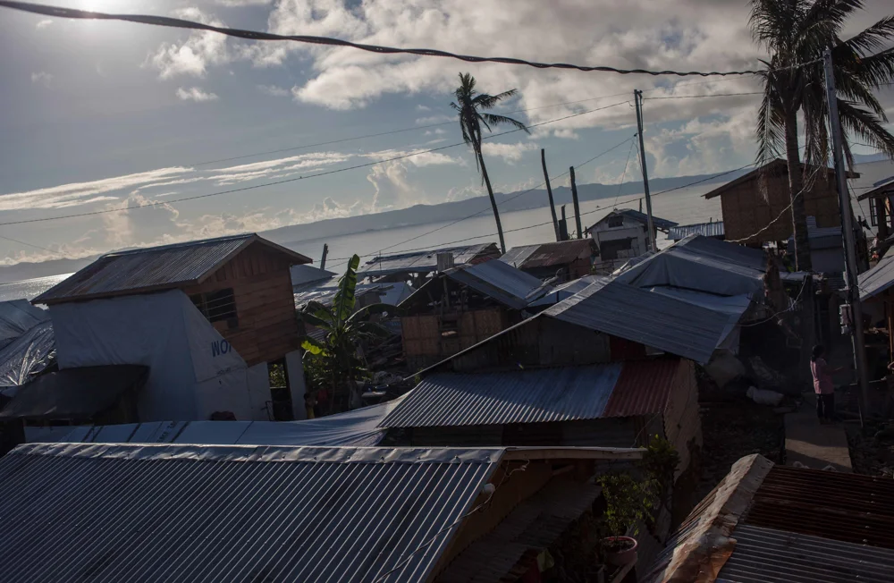  The view from the second floor balcony of the Astorga’s home where the family and many of their neighbors climbed to the rafters during the storm. “People were swimming and coming in through the second floor window just to enter,” recalled Divine. “