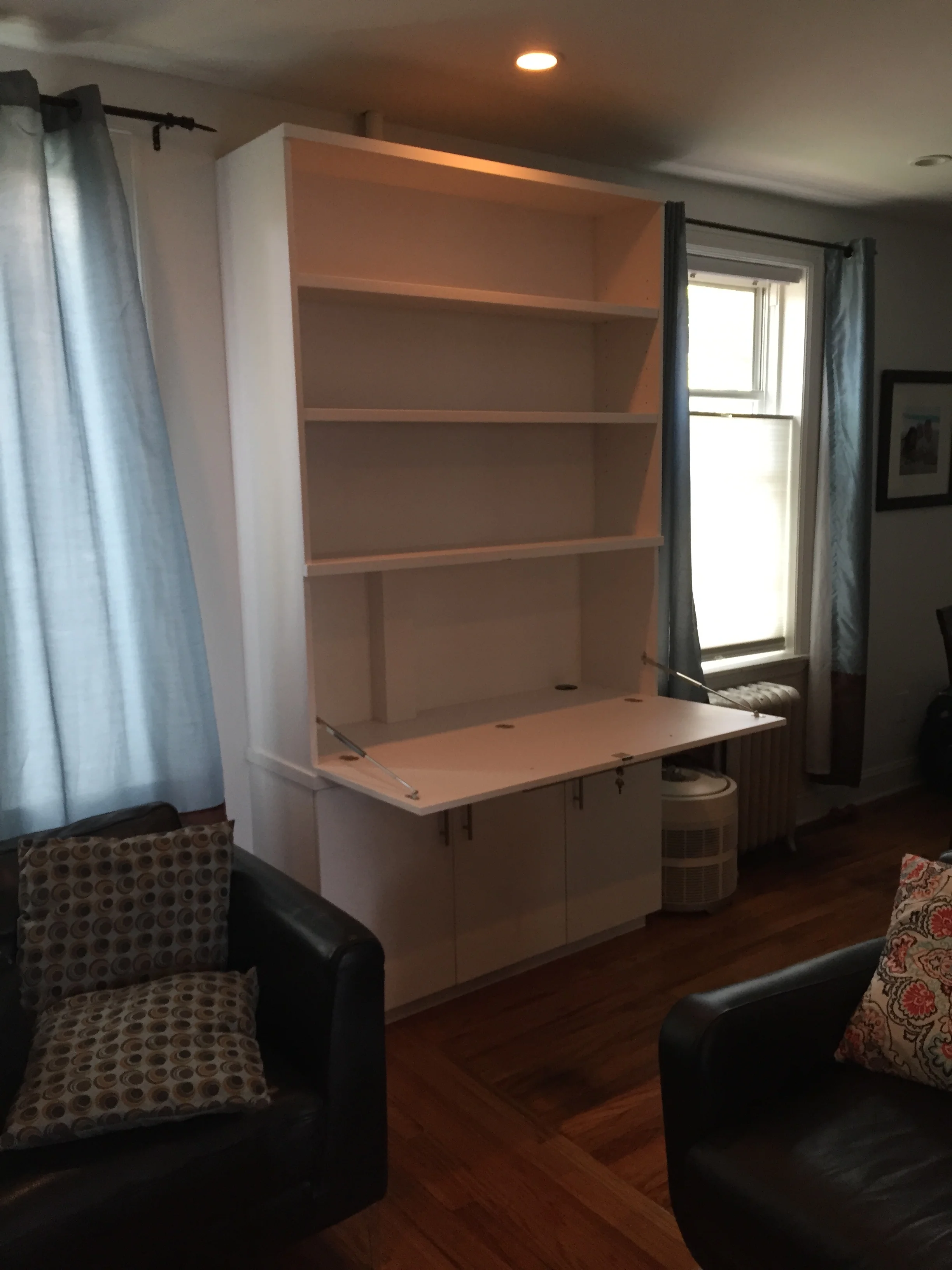 Wall unit with cabinets and a fold-out desk (open)