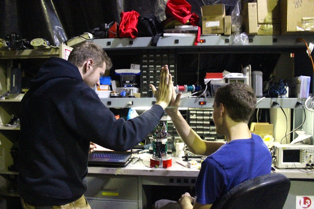 Jack and Carter celebrate fixing Hamster with an obligatory high five!