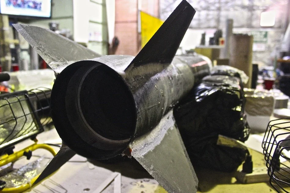 Fins are tacked on and awaiting the warm embrace of the tip-to-tip carbon.