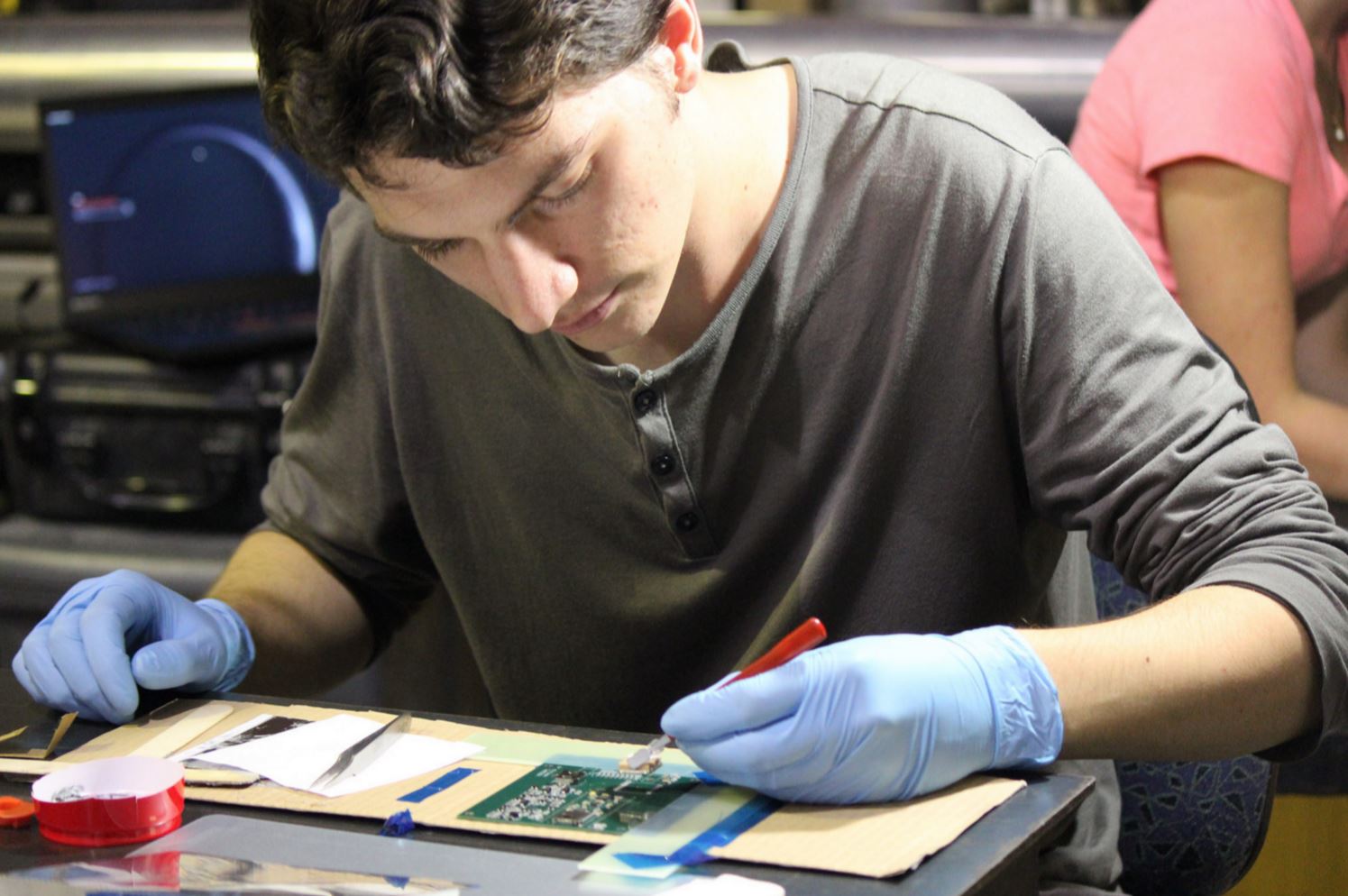 Adam adding the GPS unit to the circuit board