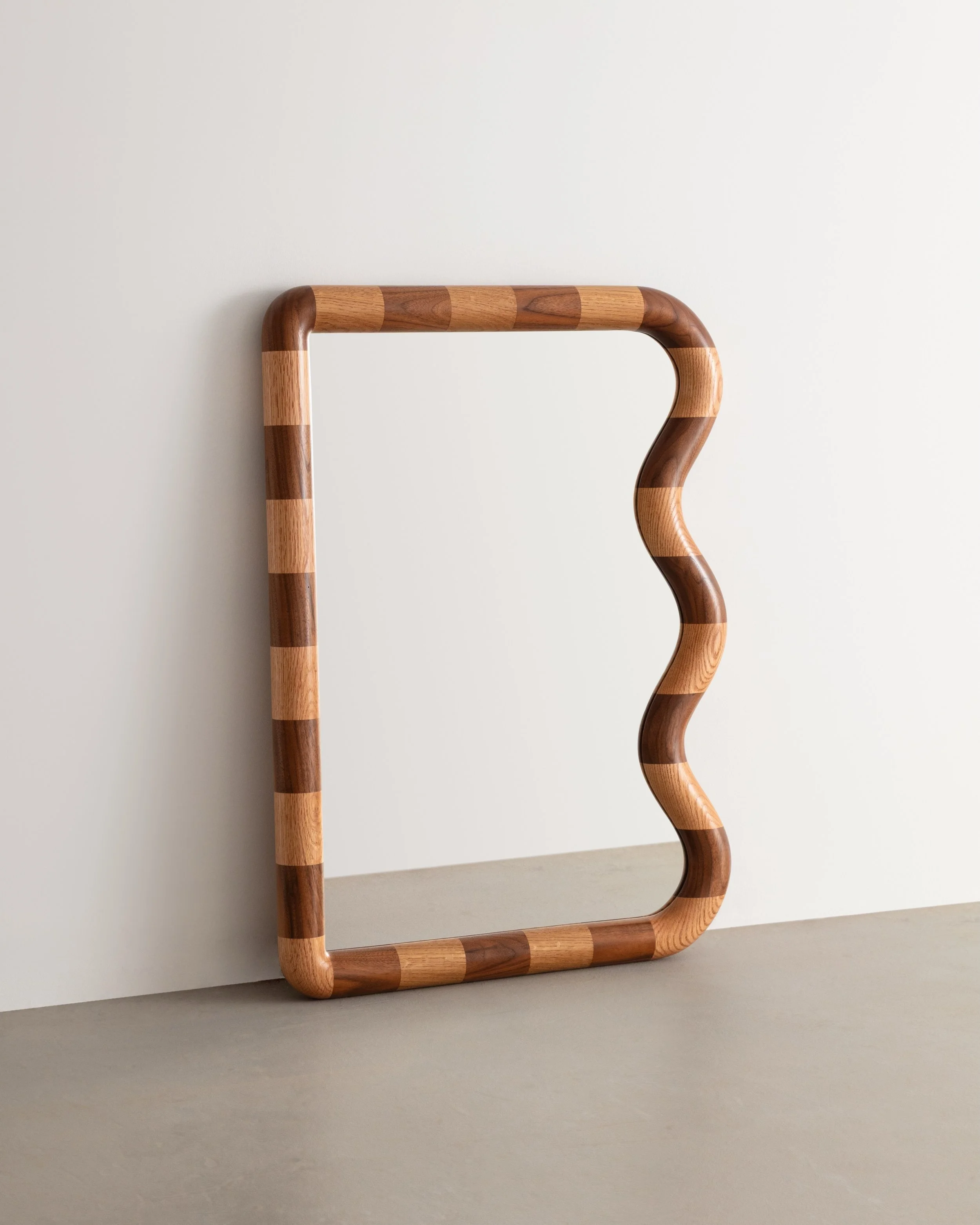 First look at the Mini Squiggle Mirror in Walnut &amp; Red Oak, a limited series.

Built with alternating hardwood blocks and shaped by hand into one continuous rounded frame.

I love how playful this one feels at this scale &mdash; somewhere between