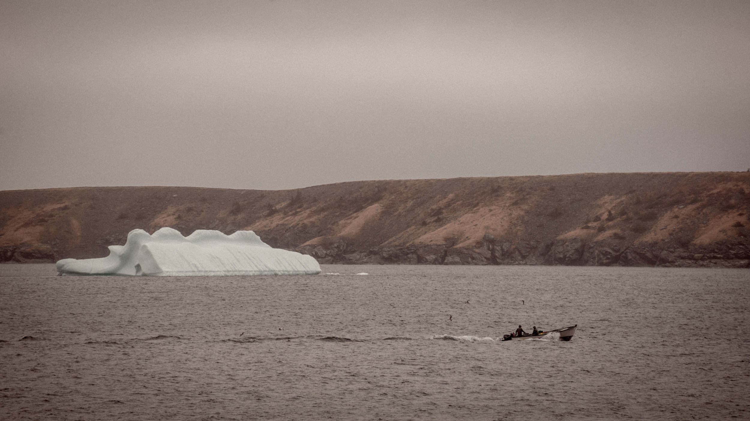 These two were out setting lobster pots. Processed this to have an older feel to it. Many of us view icebergs in wonder and appreciation, but I wonder if they were always appreciated for their natural beauty or if in an older time they were just seen as a nuisance. 