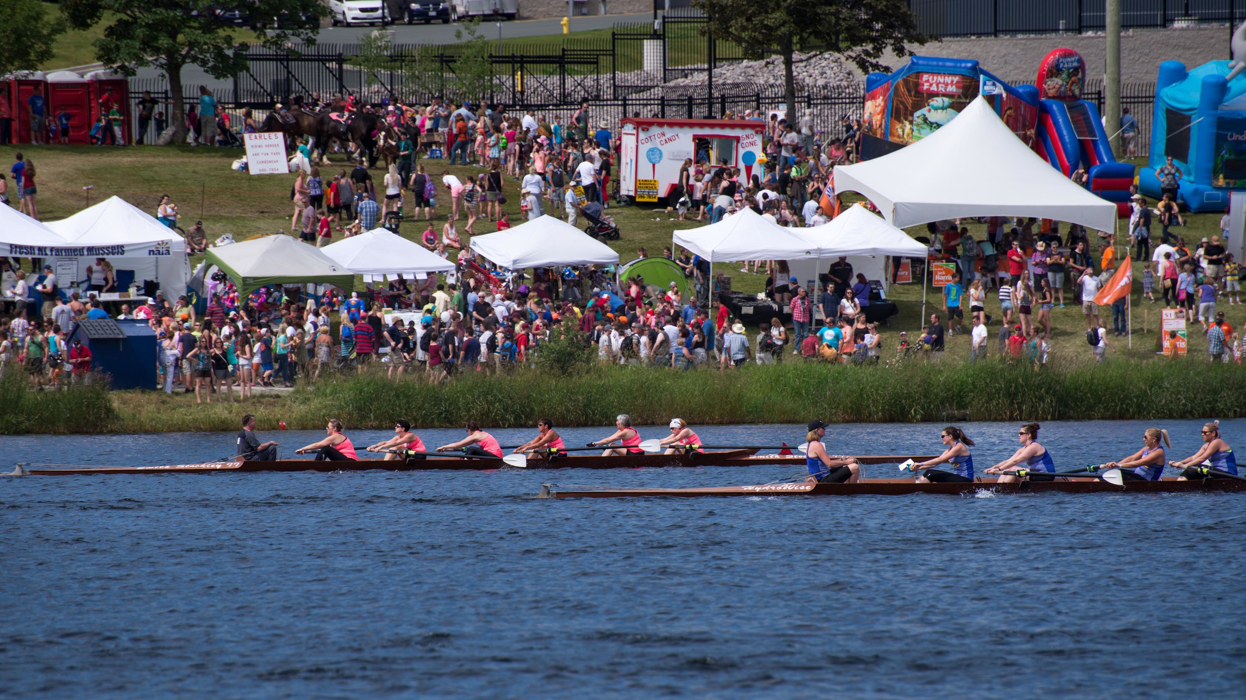 The woman rowing in the pink with the bandana in the rear of the boat is my boss, Amanda. They finished second I believe, not easy!