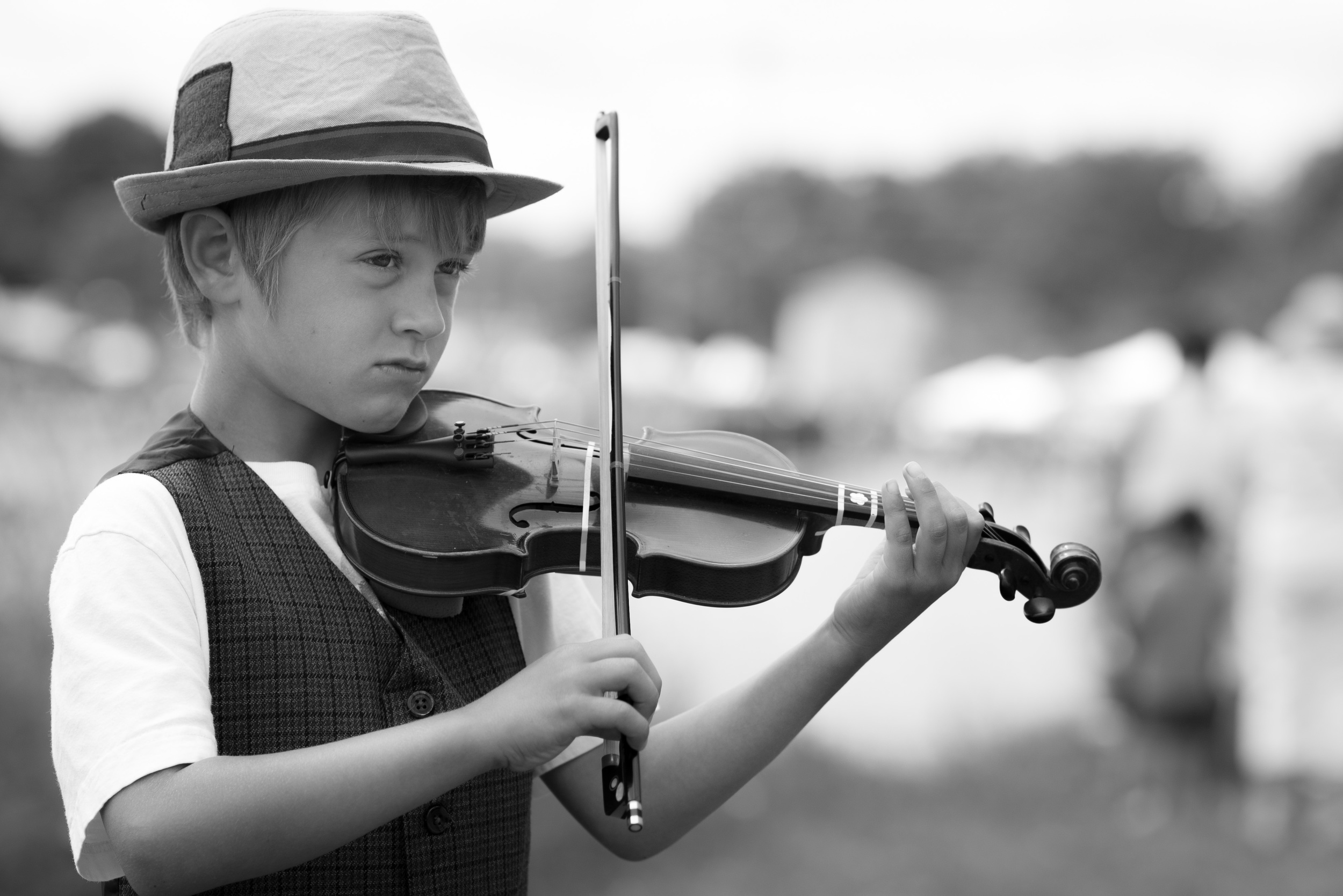 Definitely the best thing I saw at the lake today was this young feller and his brother. They were taking turns stepping forward and playing tunes. In the fiddle case was a note, "DS Fund." They were trying to raise some cash to buy a Nintendo DS, I hope they made a killing because they were really good.