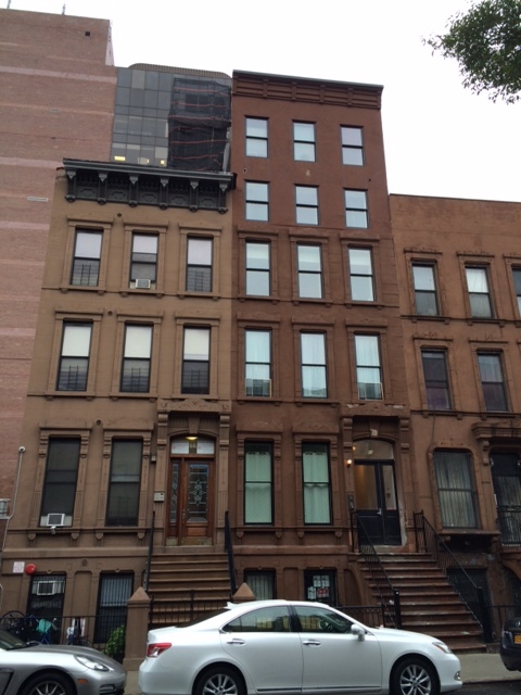 Fully renovated Central Harlem brownstone with owner's triplex and rental units