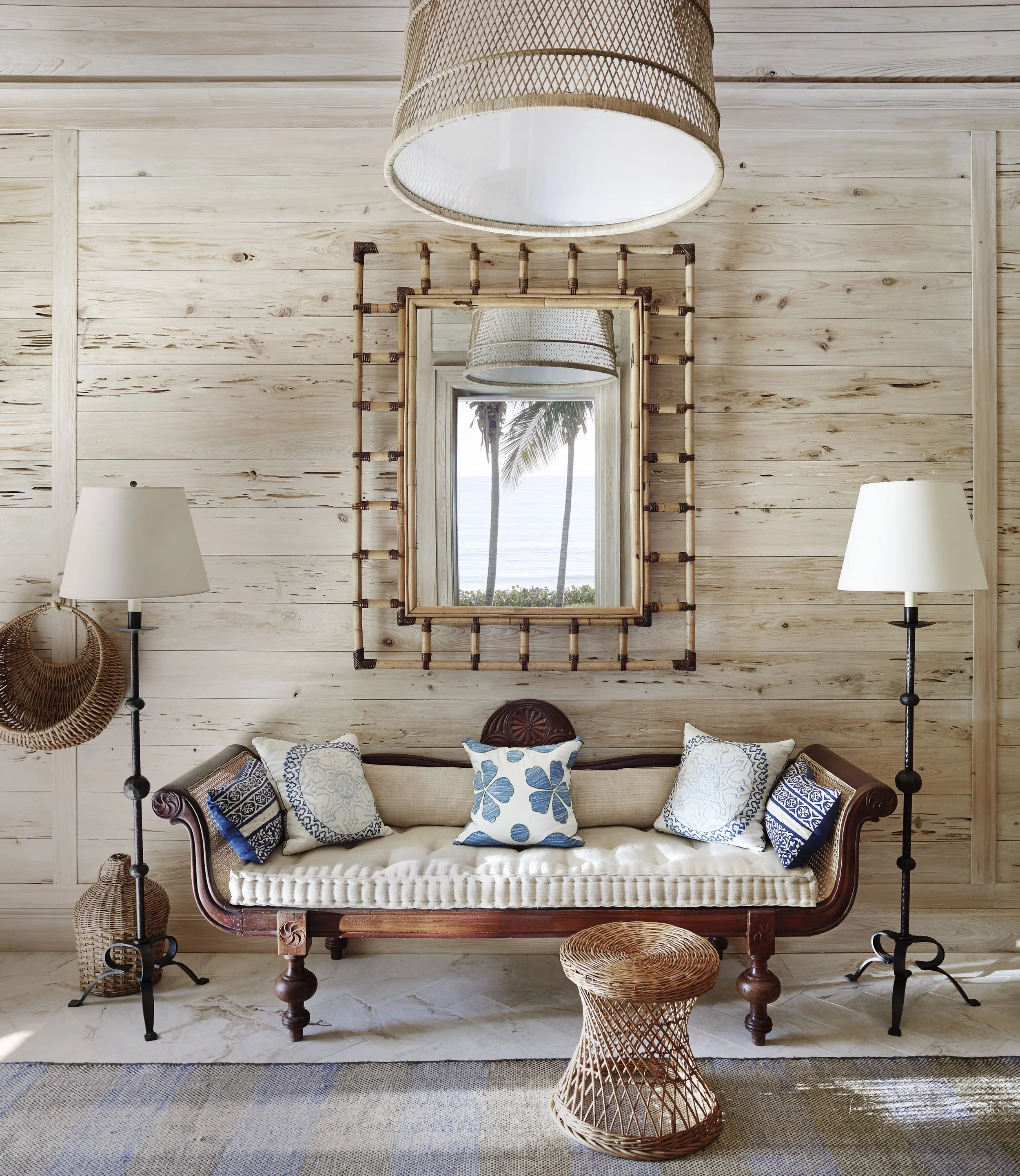 An entry hall with cypress walls, jute-and-cotton rug and Anglo-Indian Settee.