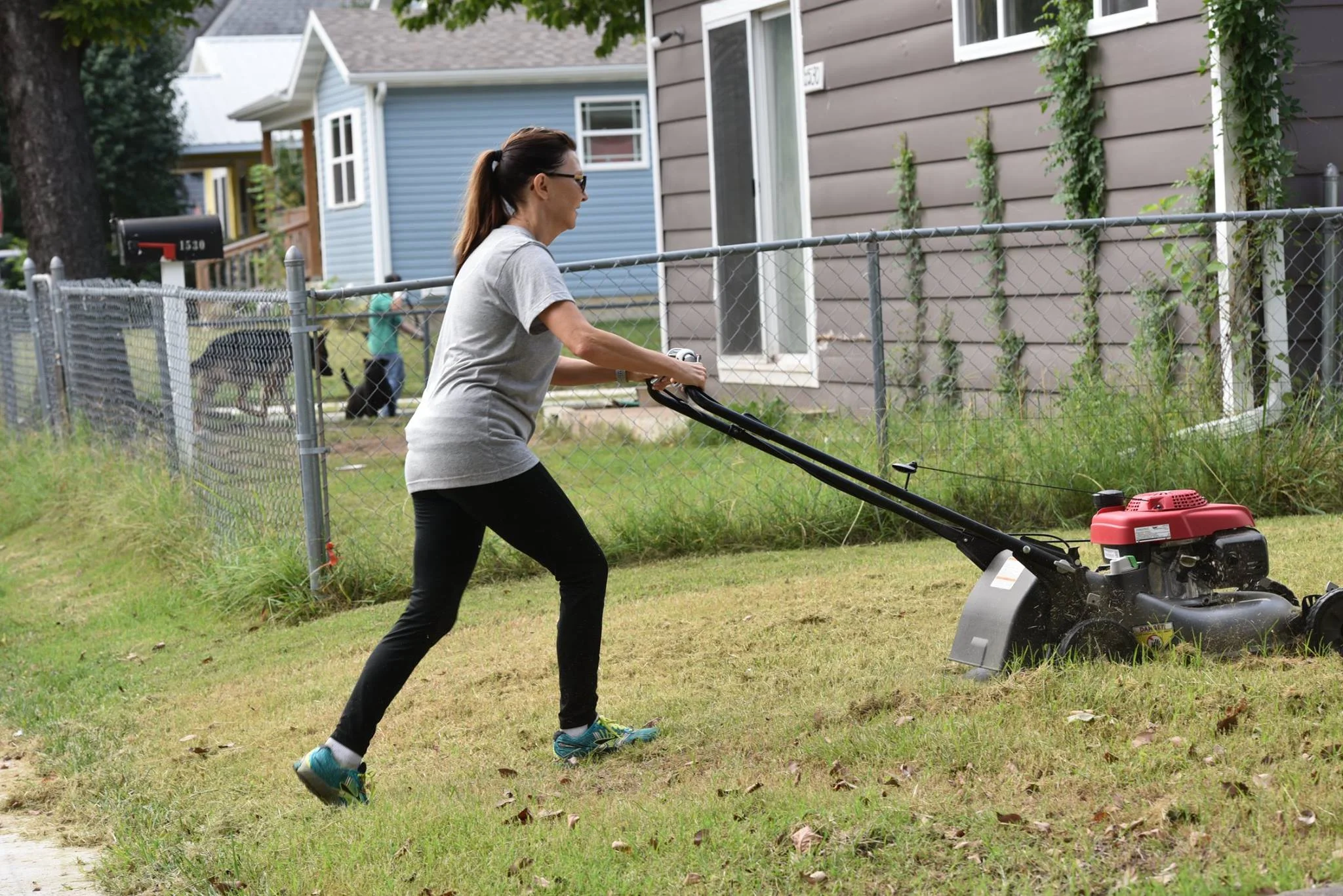 Mowing neighbor yard at LYND.jpg