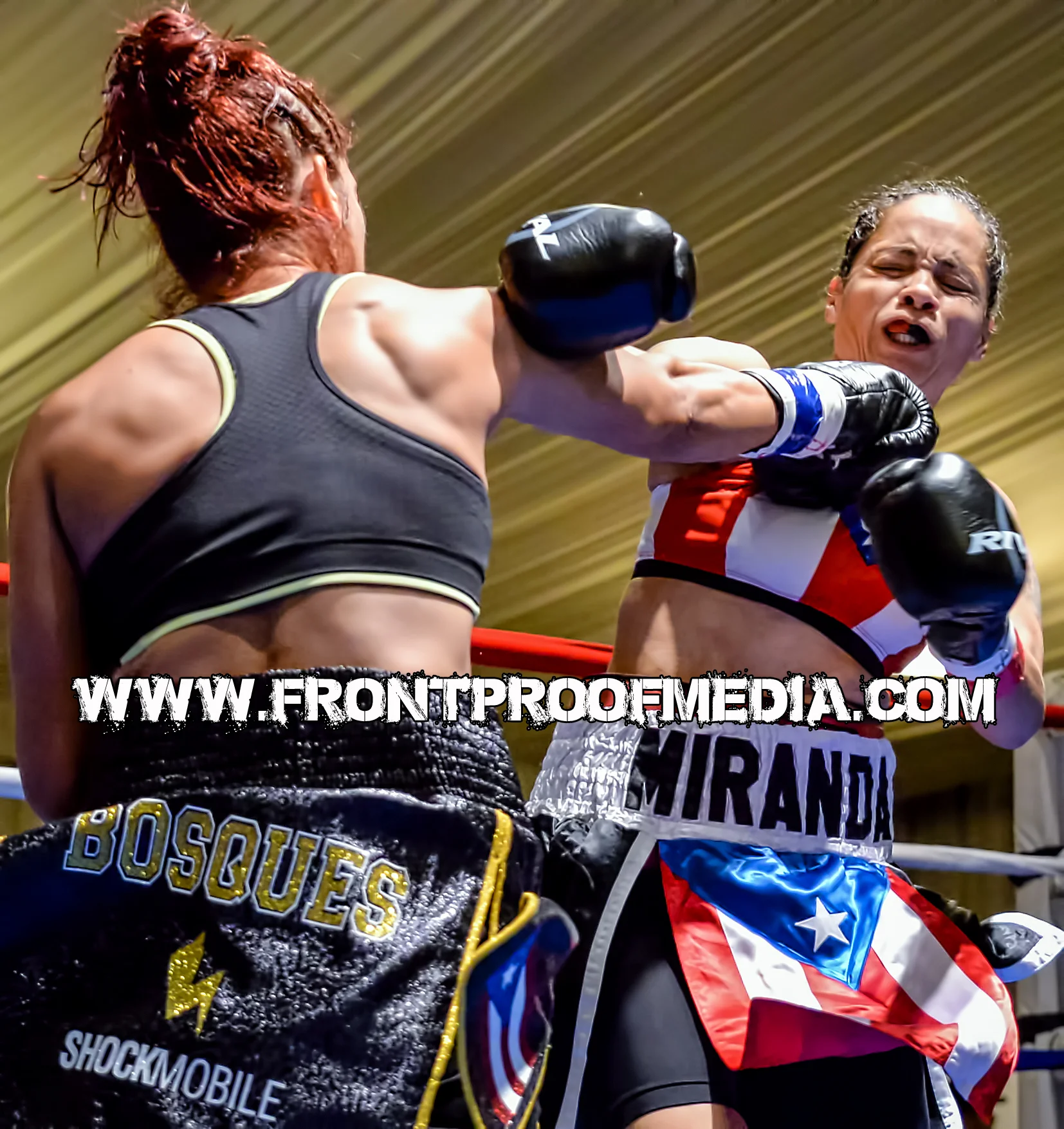Noemi Bosques lands a punishing right hand to the chin of Marisol Miranda during their WIBA title fight on Aug 22, 2015 in St. Petersburg, FL
