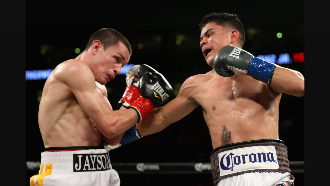 Diaz lands a right to the body of Velez. Photo by Ezra Shaw at Getty Images