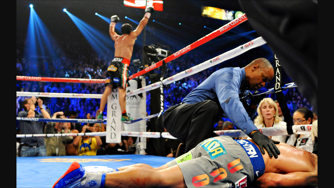 Marquez celebrates his knockout victory over a fallen Pacquiao. Photo: HBO