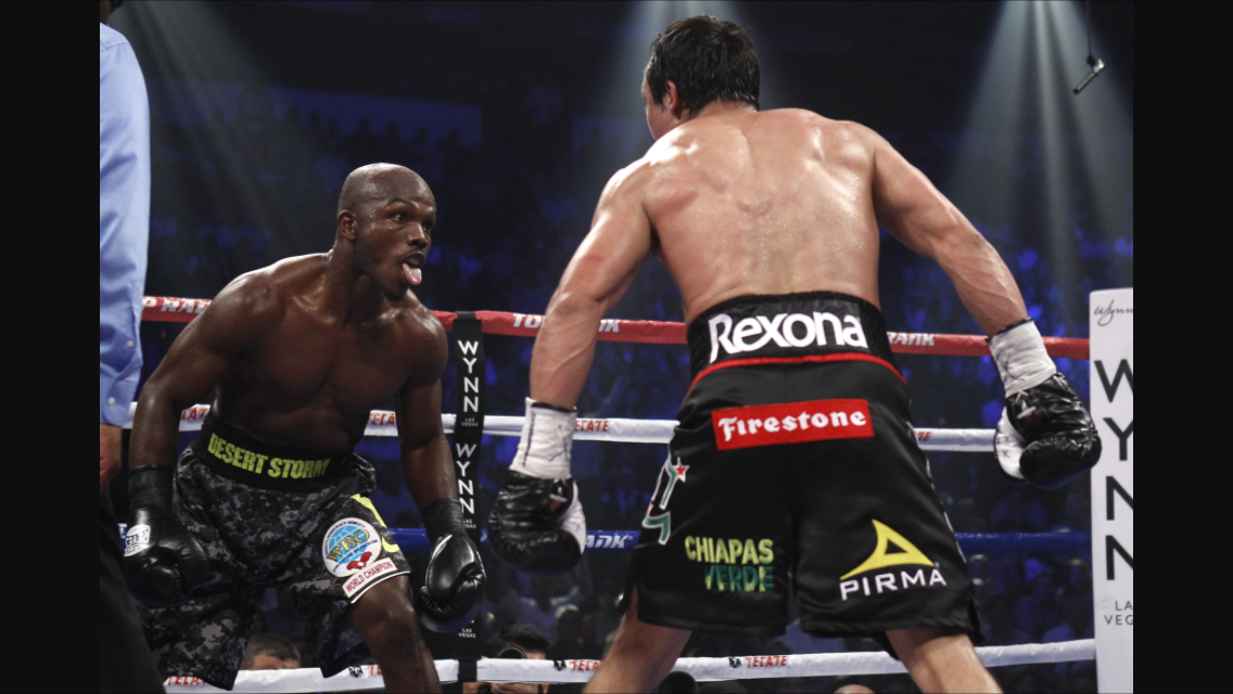 Bradley taunts Marquez during their bout in October 2013. Photo: HBO