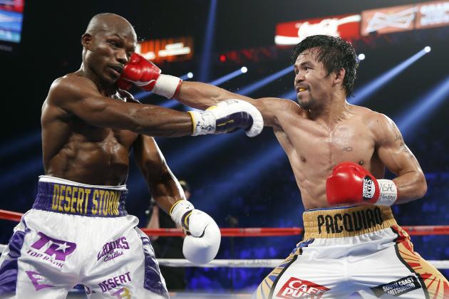 Manny Pacquiao lands a straight right hand against Tim Bradley Jr. on April 9, 2016. Photo: Isaac Brekken/Associated Press.