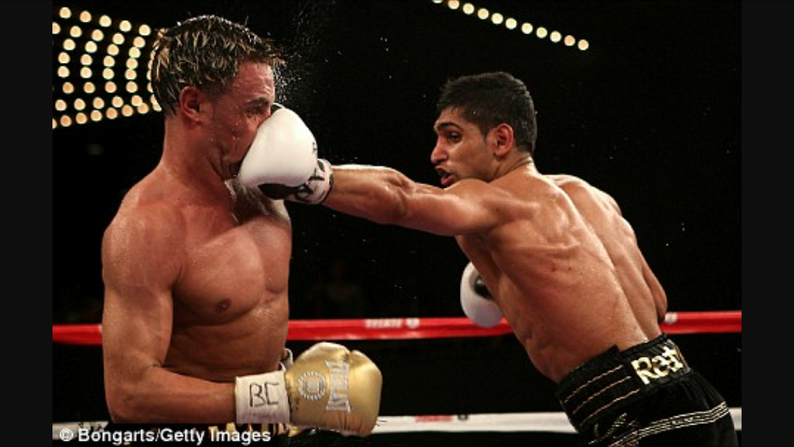 Khan smashes Malignaggi's face with a jab. Photo: Bongarts/Getty Images