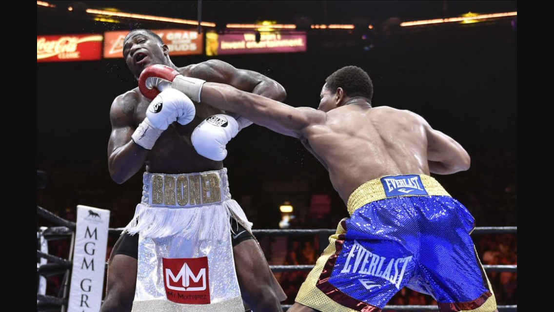 Shawn Porter lands a left jab on Adrien Broner. The bout took place at a catch weight of 144. Porter dominated the fight for 11 straight rounds. Photo: David Becker/AP