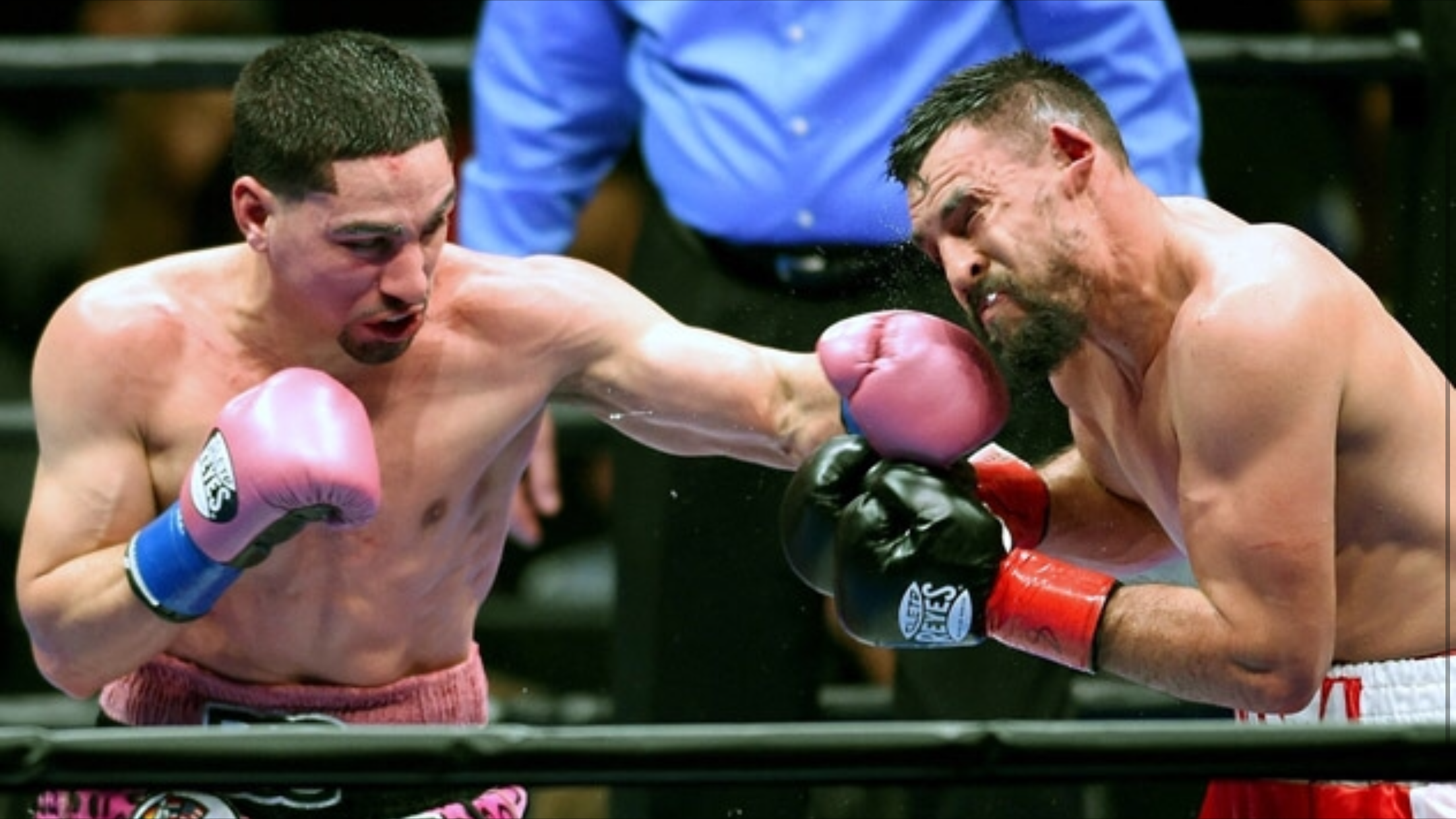 Danny Garcia lands a left hook on Robert Guerrero. Garcia won the vacant WBC welterweight title against Guerrero. Photo: Naoki Fukuda/RingTV