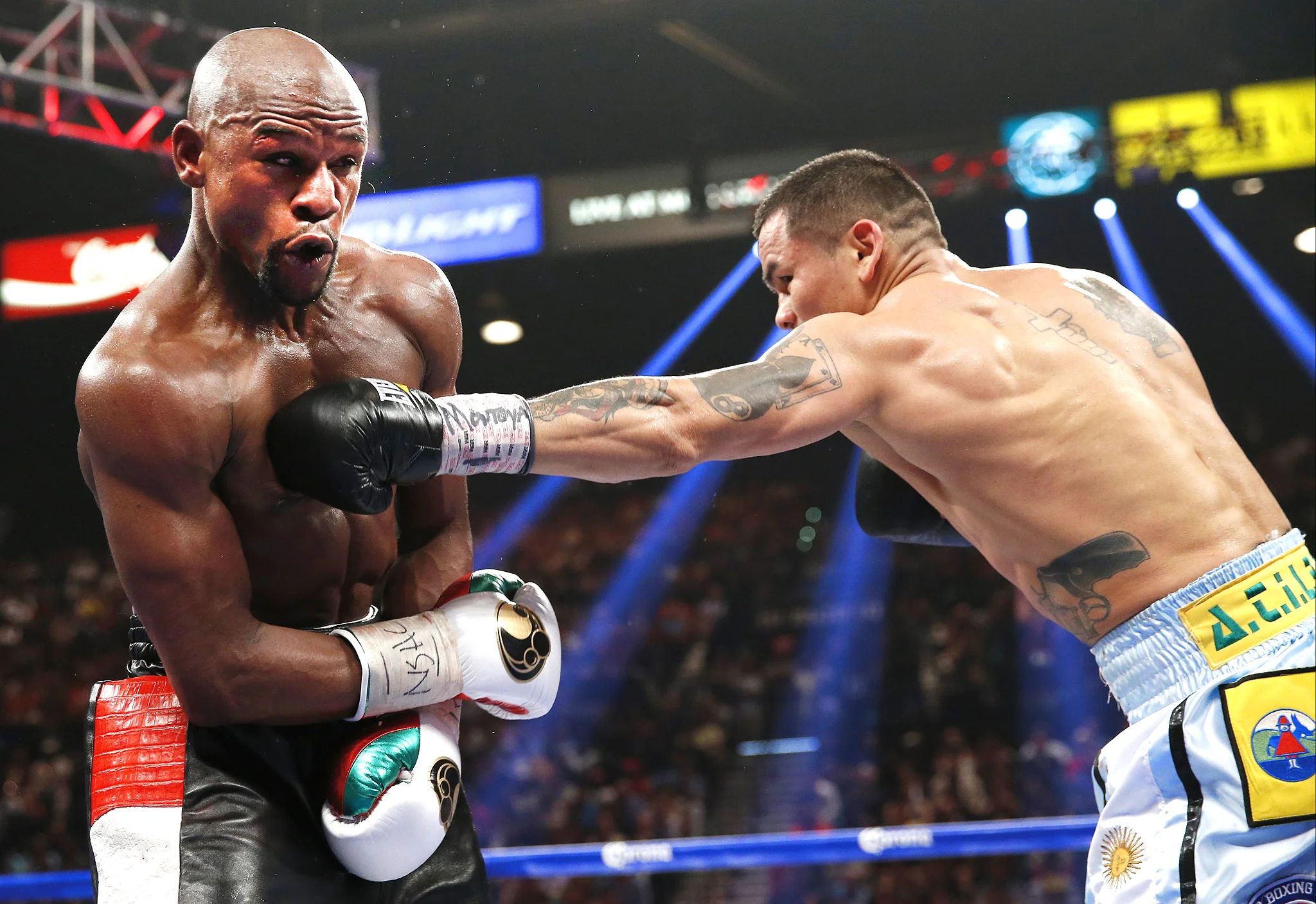 Marcos Maidana lands a left hand on Floyd Mayweather. Photo: Eric Jamison/Associated Press