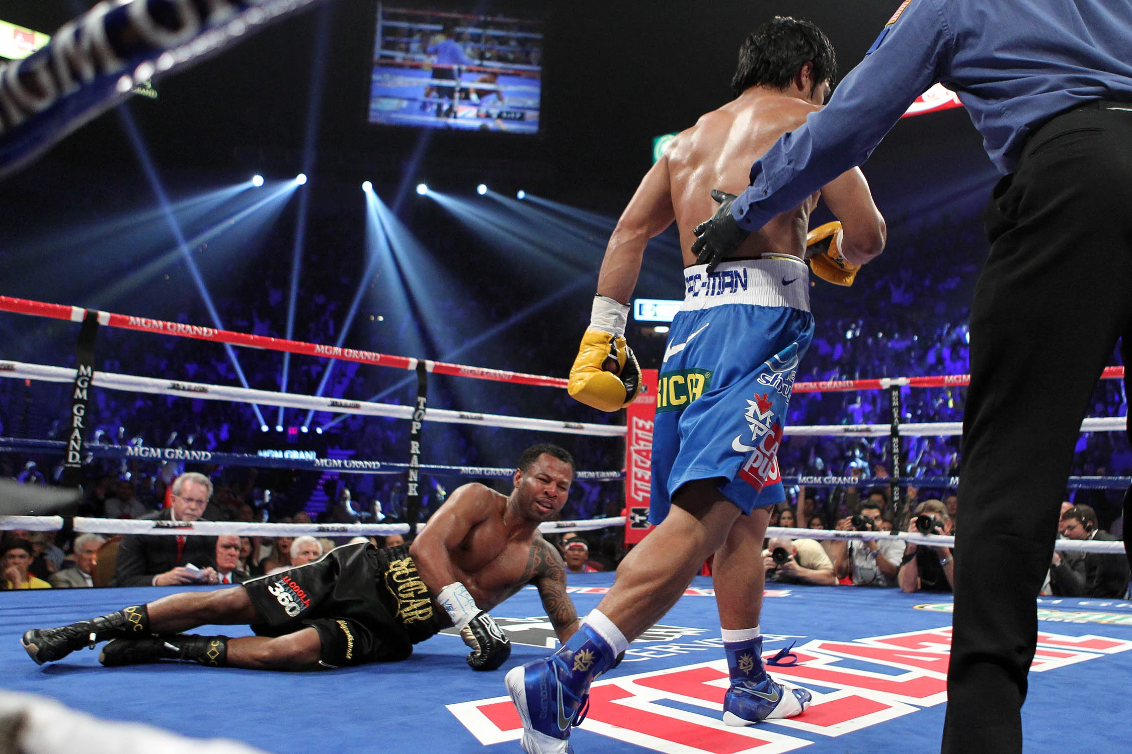 Pacquiao walking to the neutral corner after scoring a knockdown on Shane Mosley in their May 2011 fight. Photo: Tom Casino/Showtime