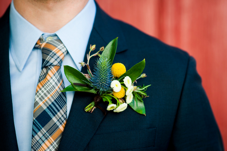 Boutonniere of Chamomile, thistle, and Billy Balls.