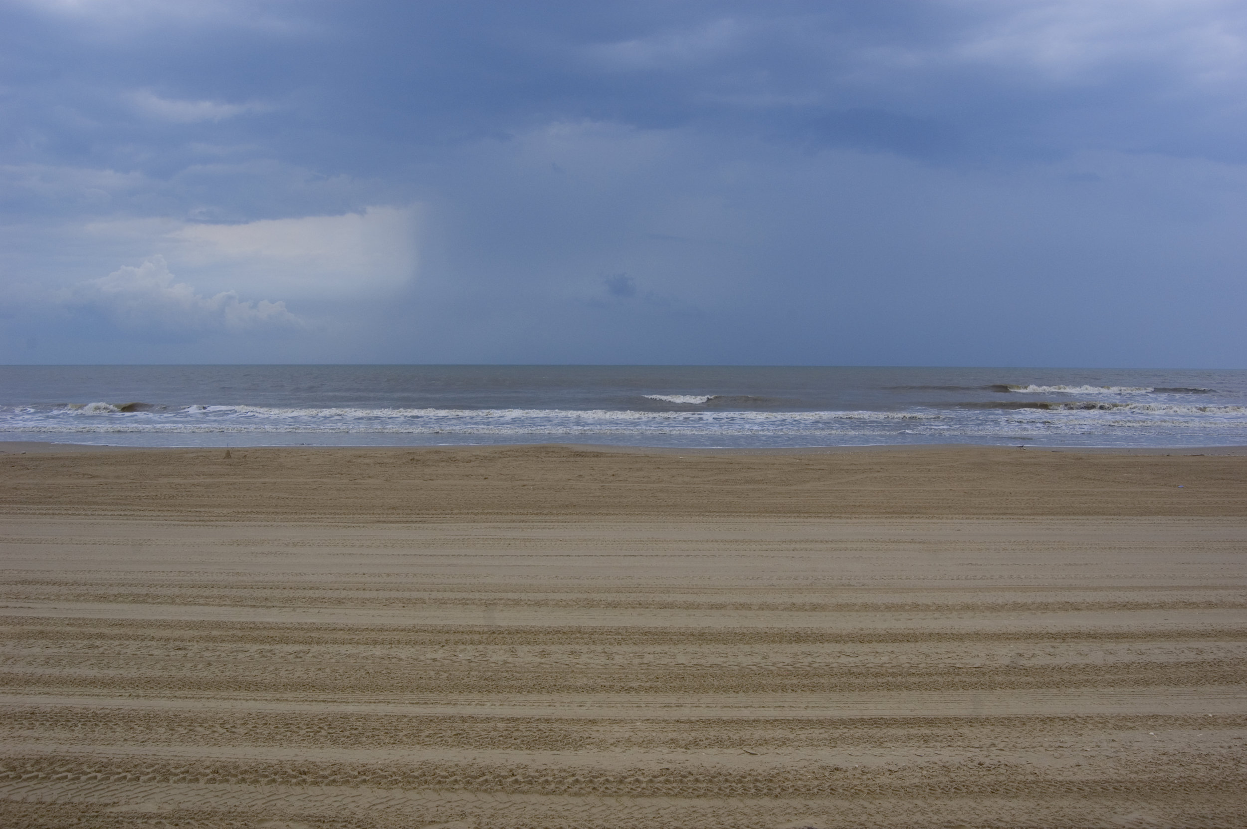 Crystal Beach with off-shore rain showers.