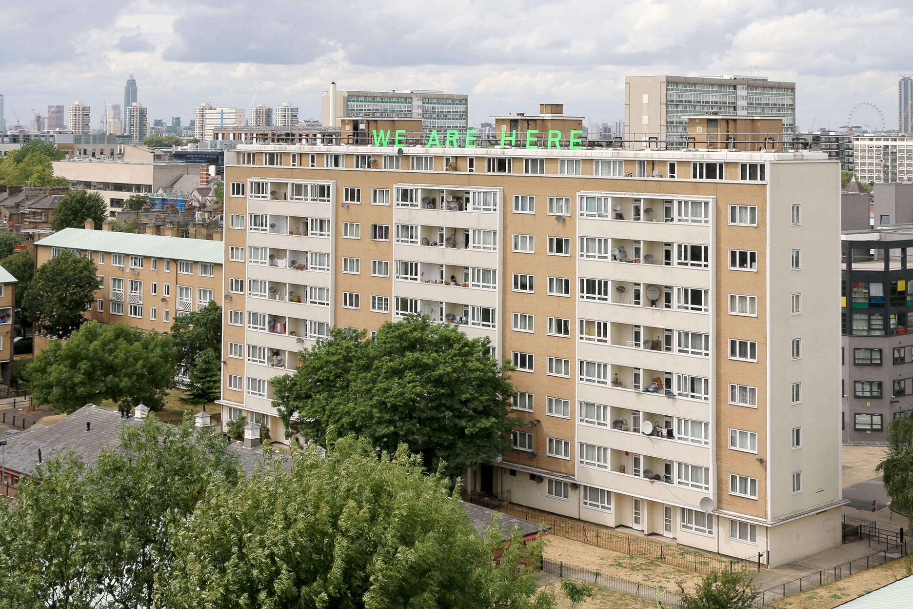 Jessie Brennan, We Are Here (2018), text installation, Pelican Estate [view from Crane House].jpg