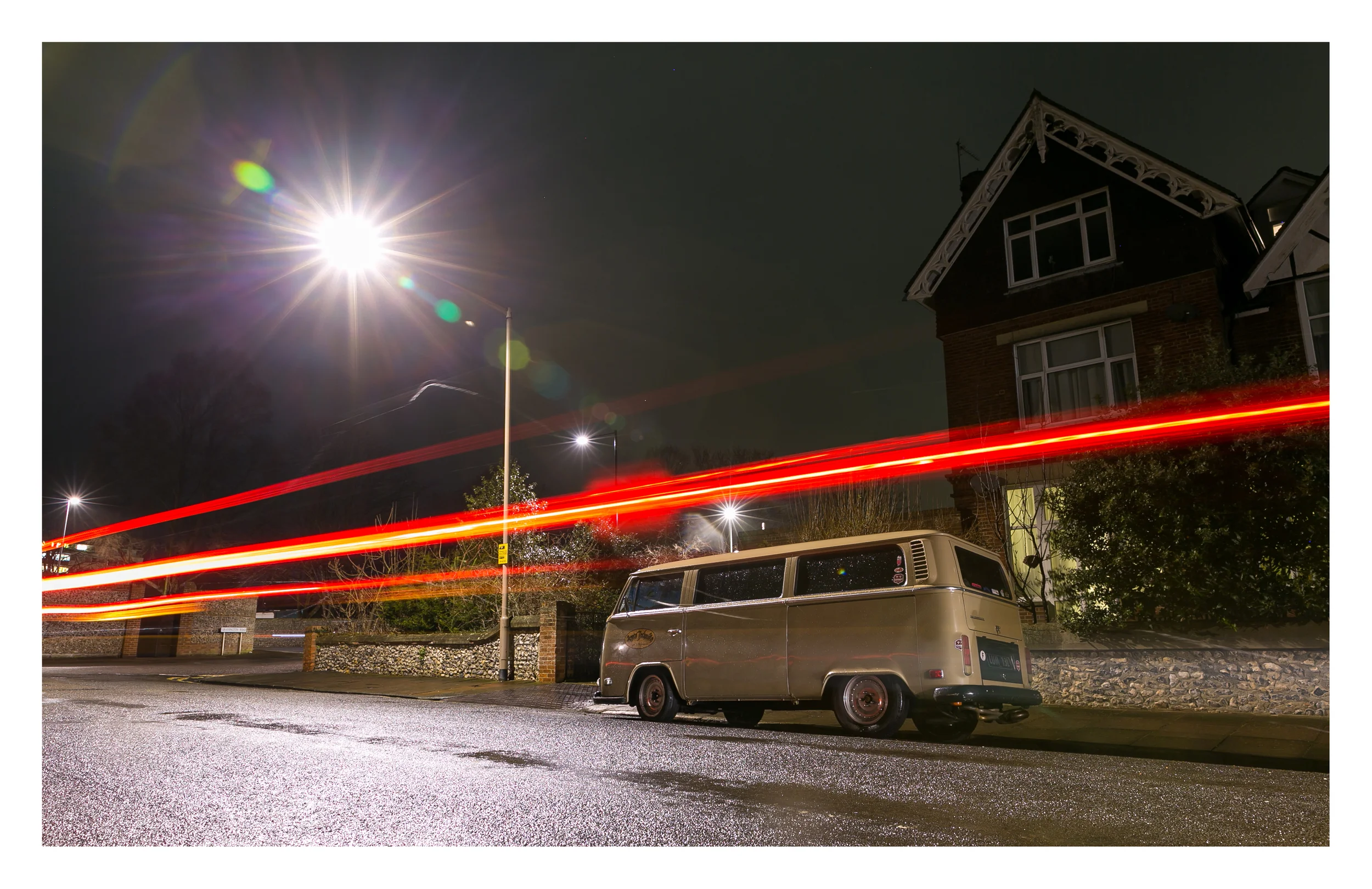 Latest photography posted on my Flickr Photo Stream Night-time view of a restored customised VW Kombi (Combi) that is local to Eastbourne. It can be tricky shooting cars at night, especially when the best angle is on the other-side of a busy rat run cut through, and you have to allow for 30 odd second exposures, and often have the risk of a light trail running through the shot. On this occasion the combination of low angle for the composition and the happy occurrence of a passing car across the shot led to this pleasing combination of effect, composition and subject matter. 
