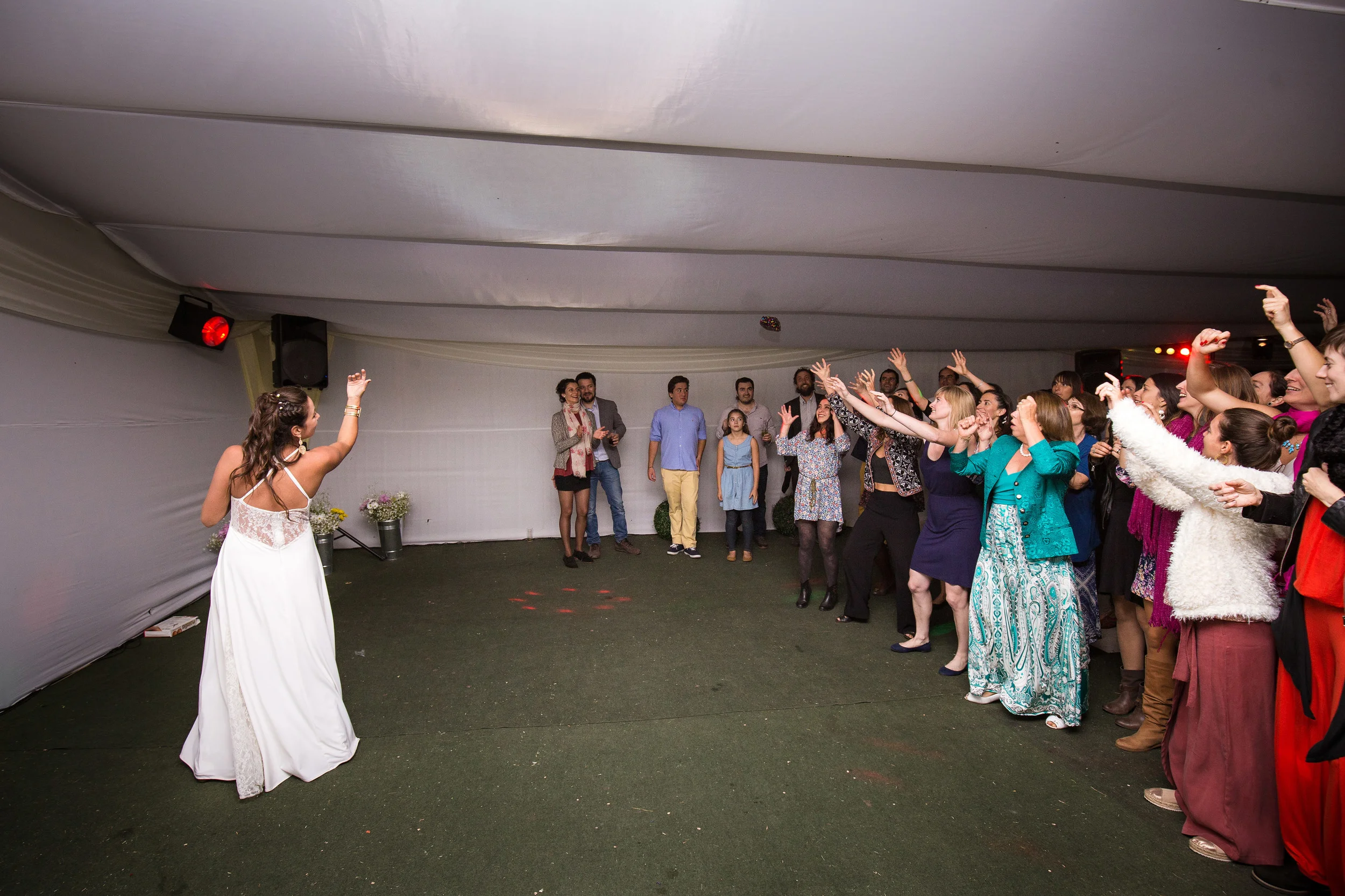 Throwing a bouquet or garter? Way too old school, and there weren't many single ladies, so they have decided for a newer tradition, they were tossing surprises for their guests. :)