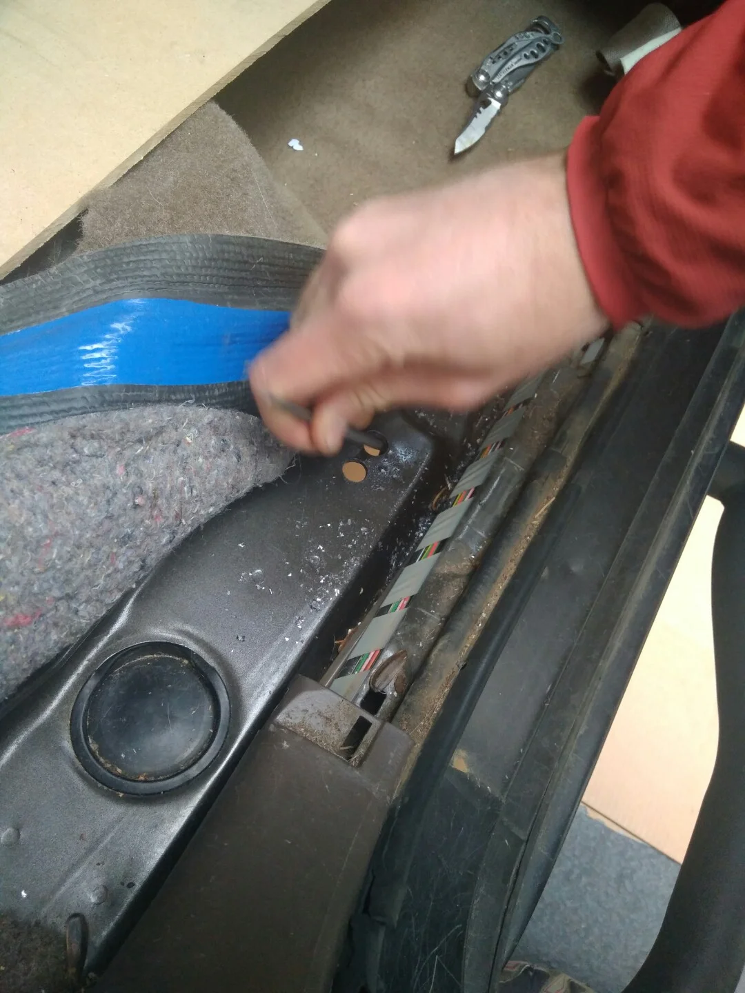 Metal file used to eliminate sharp edges on the holes in the floor.jpg