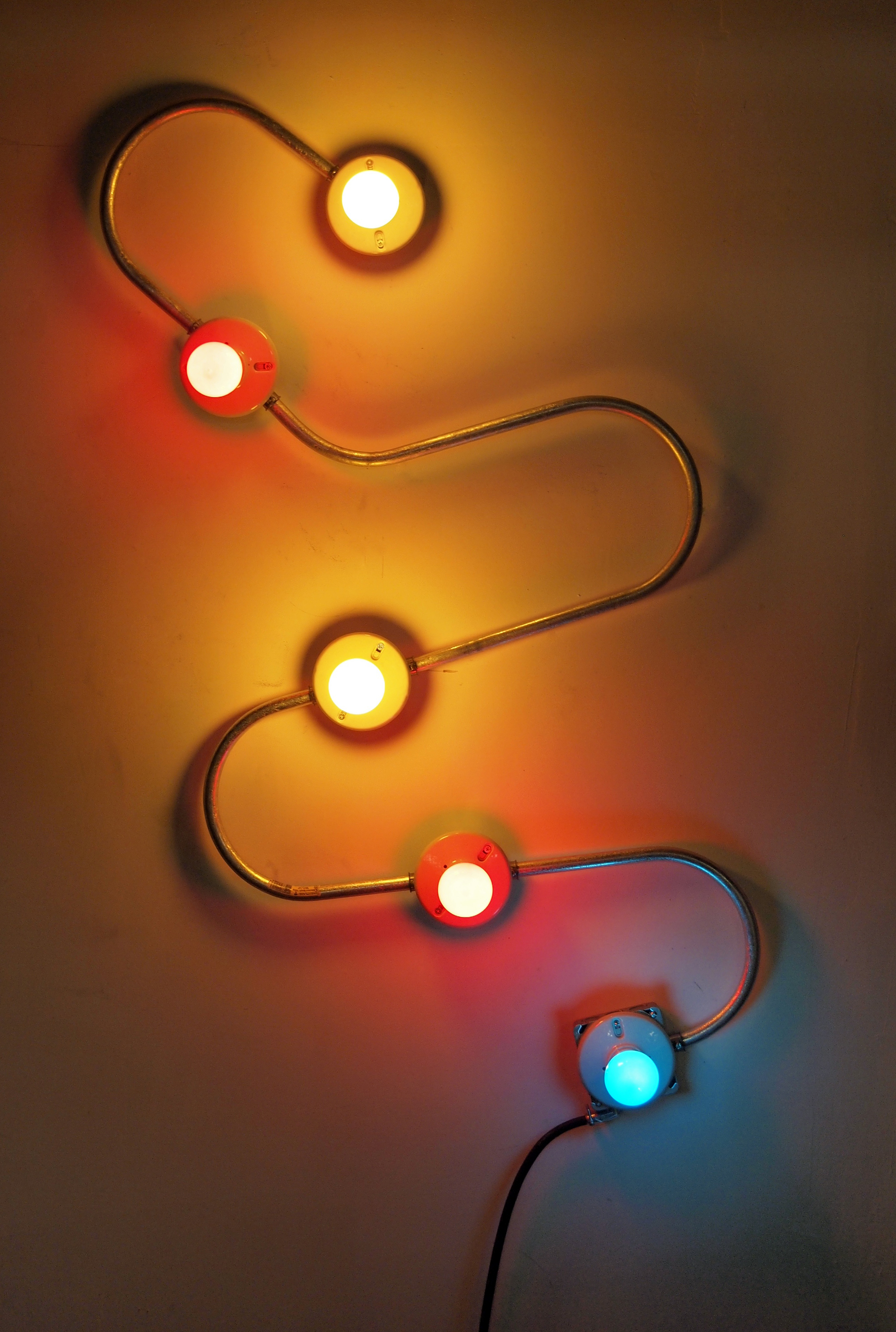   Conduits in Red, Yellow and Blue (Figure 17)  , 2013.&nbsp;  Galvanized steel, copper wire, porcelain fixtures and ceramic coated light bulbs.&nbsp;  