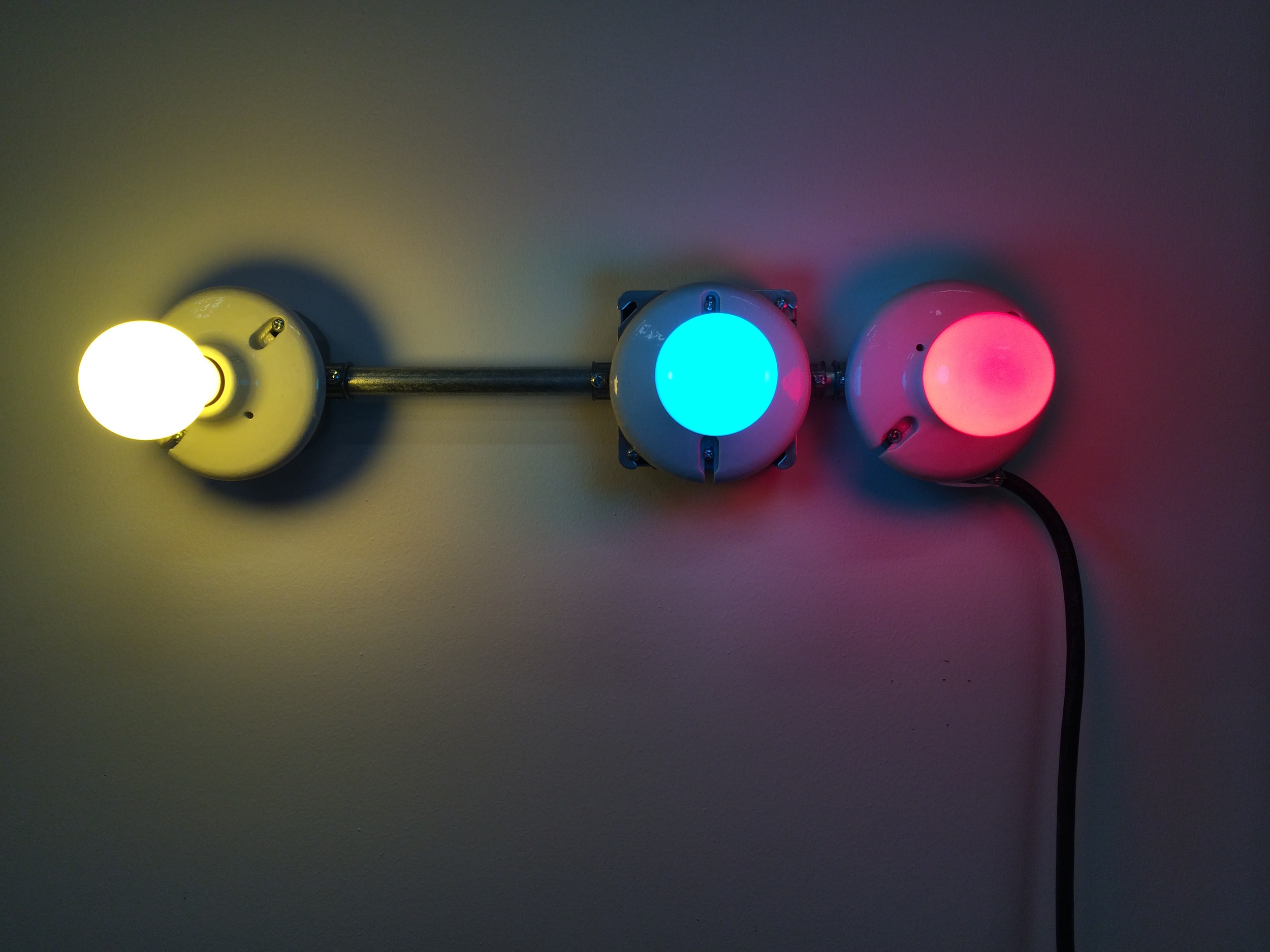   Conduits in Red, Yellow and Blue (Figure 29)  , 2014.&nbsp;Galvanized steel, copper wire, porcelain fixtures and ceramic coated light bulbs.  