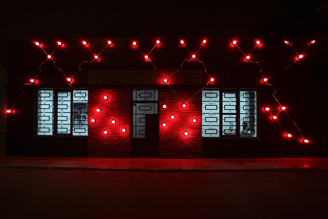 Constellation in Red (Figure 8) , 2014. Galvanized steel, copper wire, porcelain fixtures and ceramic coated light bulbs. Facade of Revolver Galeria, Lima, Peru.