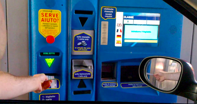 How to use the toll booth machine: When you enter the toll booth (getting onto the highway), simply take a ticket. When you exit the toll booth (getting off the highway) enter your ticket below the green arrow (as seen in the photo above). The amount you owe will be shown on the screen. Enter coins where it says "coins only" and enter bills where it says "bills only." Change will be dispensed below the screen. 