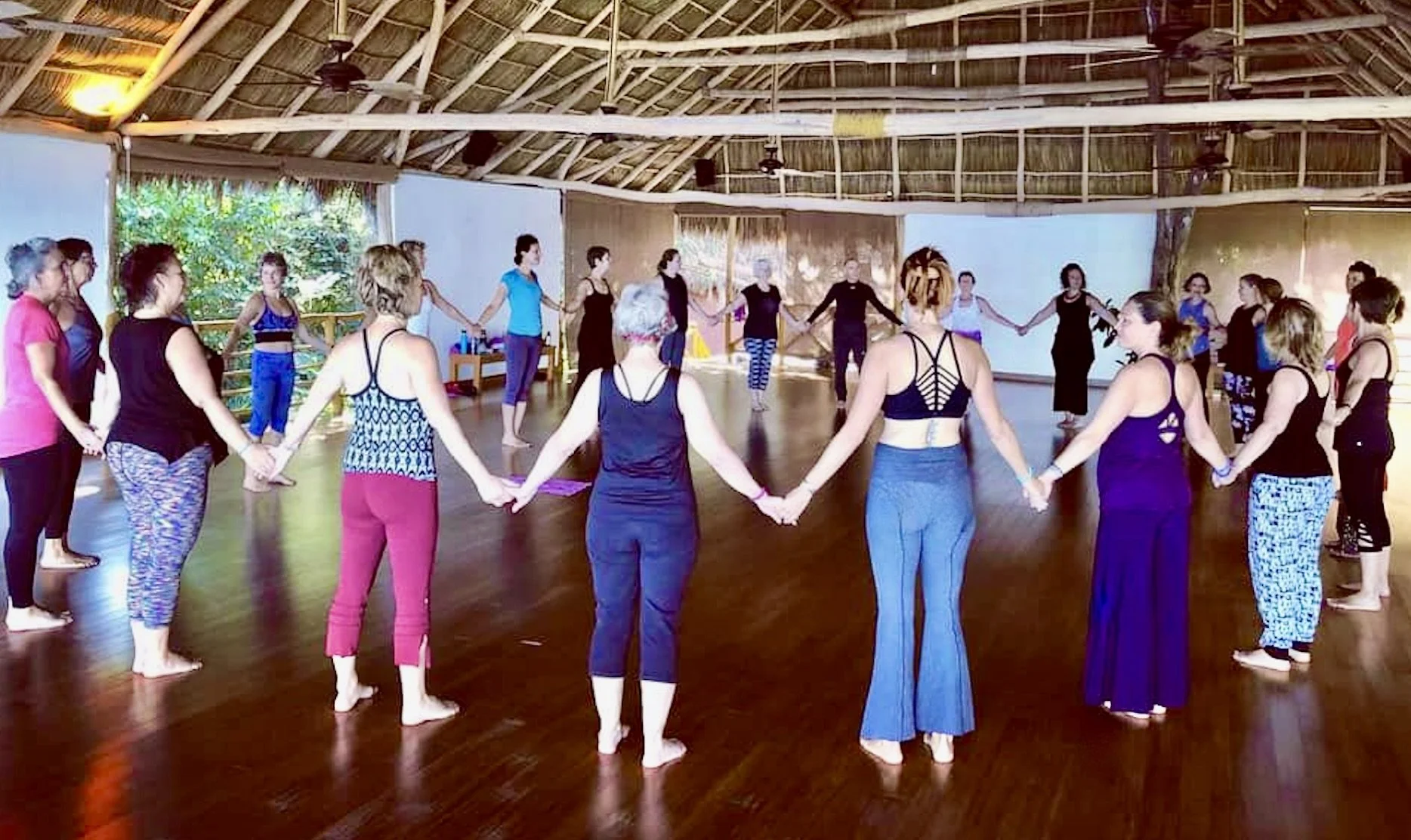 Xinalani Group Circle Holding Hands.jpeg