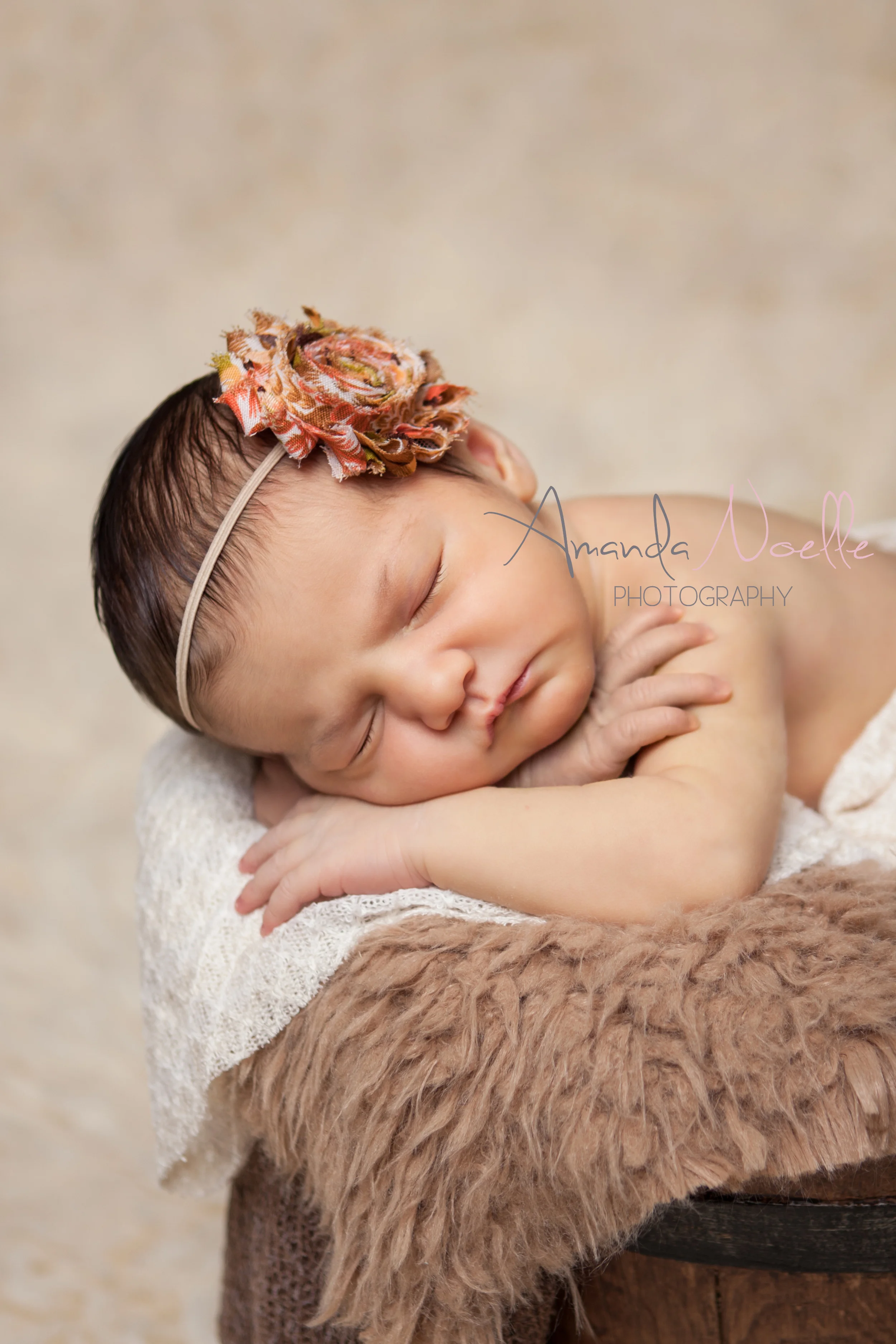 Newborn baby girl, in bucket, layering fabric and fur, headband shabby chic flower, brown creme orange, sleeping prop pose by Westchester County, New York, Newborn Photographer, Amanda Noelle Photography.