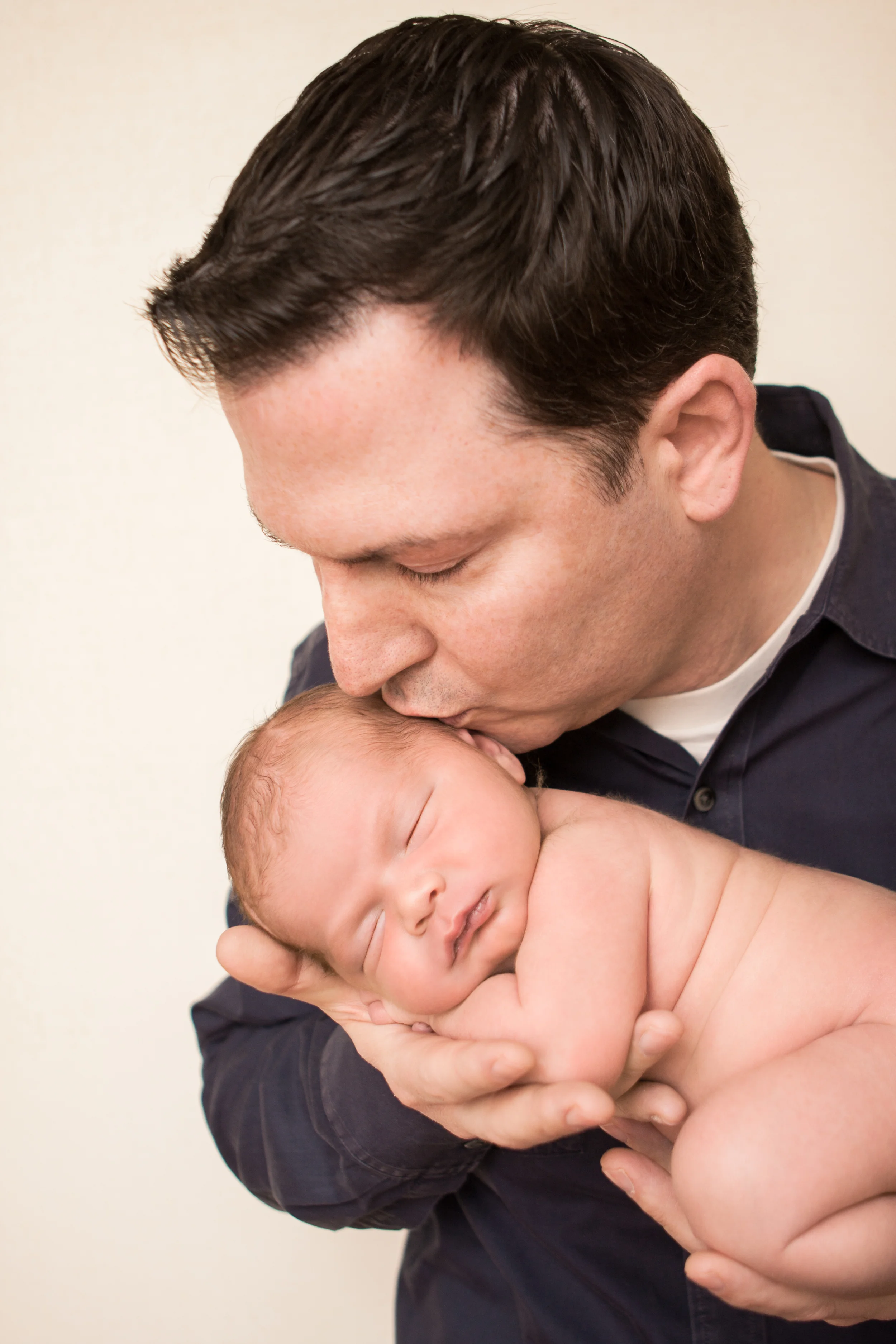 Newborn baby boy chubby big squishy in dad's arms parent photos, Westchester County, New York newborn photographer, Amanda Noelle Photography.
