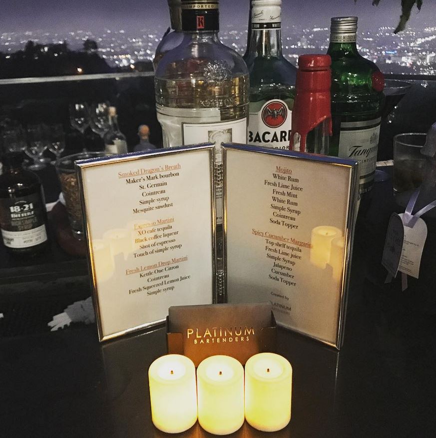 Custom printed cocktail menu on a bar at a Breville event