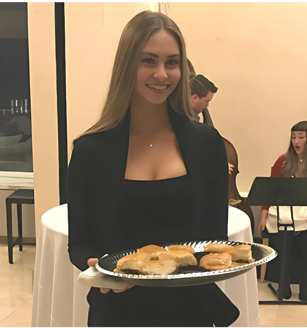 Platinum model server passing food at a Los Angeles event