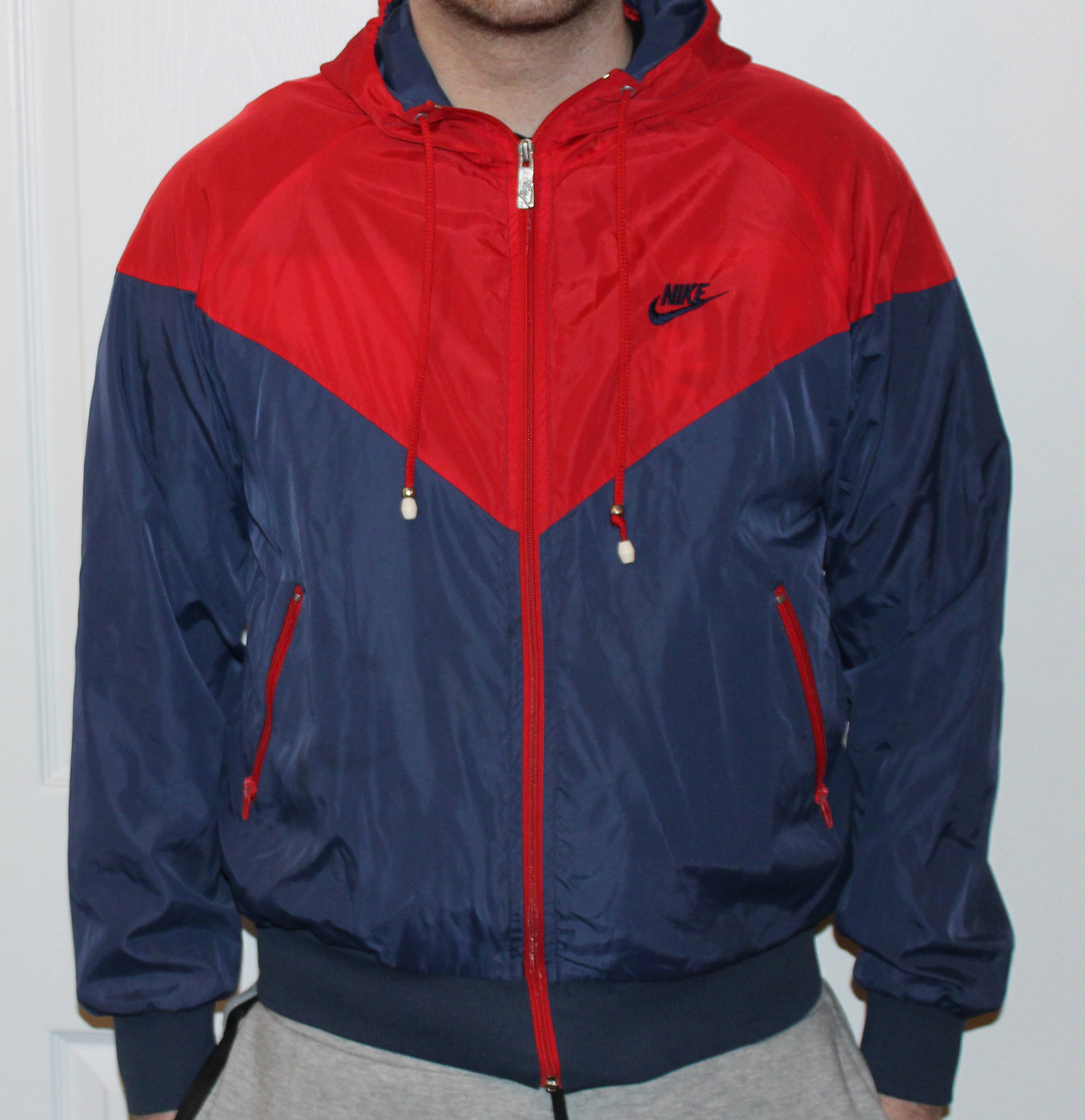 navy blue and red nike windbreaker