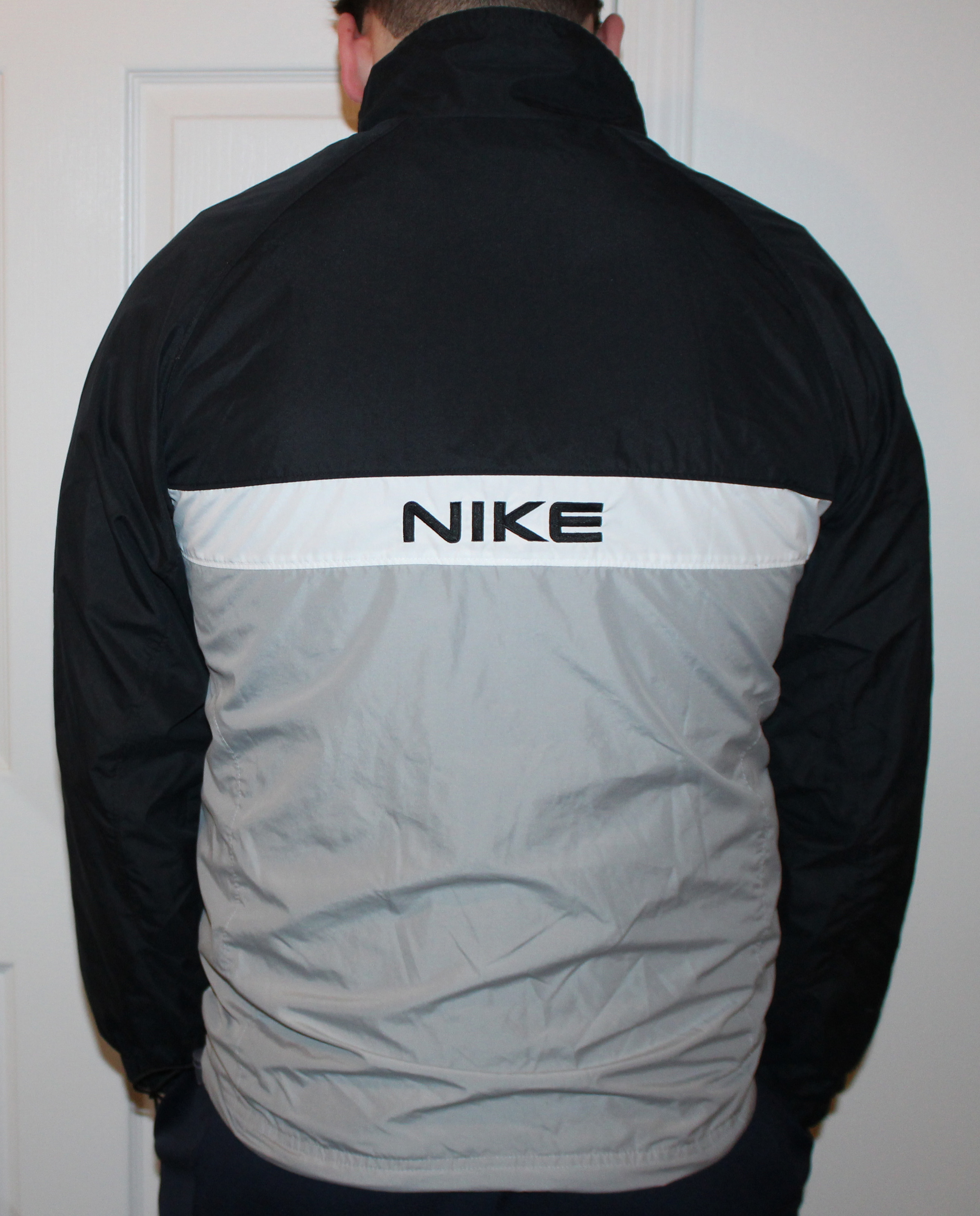 Nike spell out microfiber windbreaker in grey/black/white