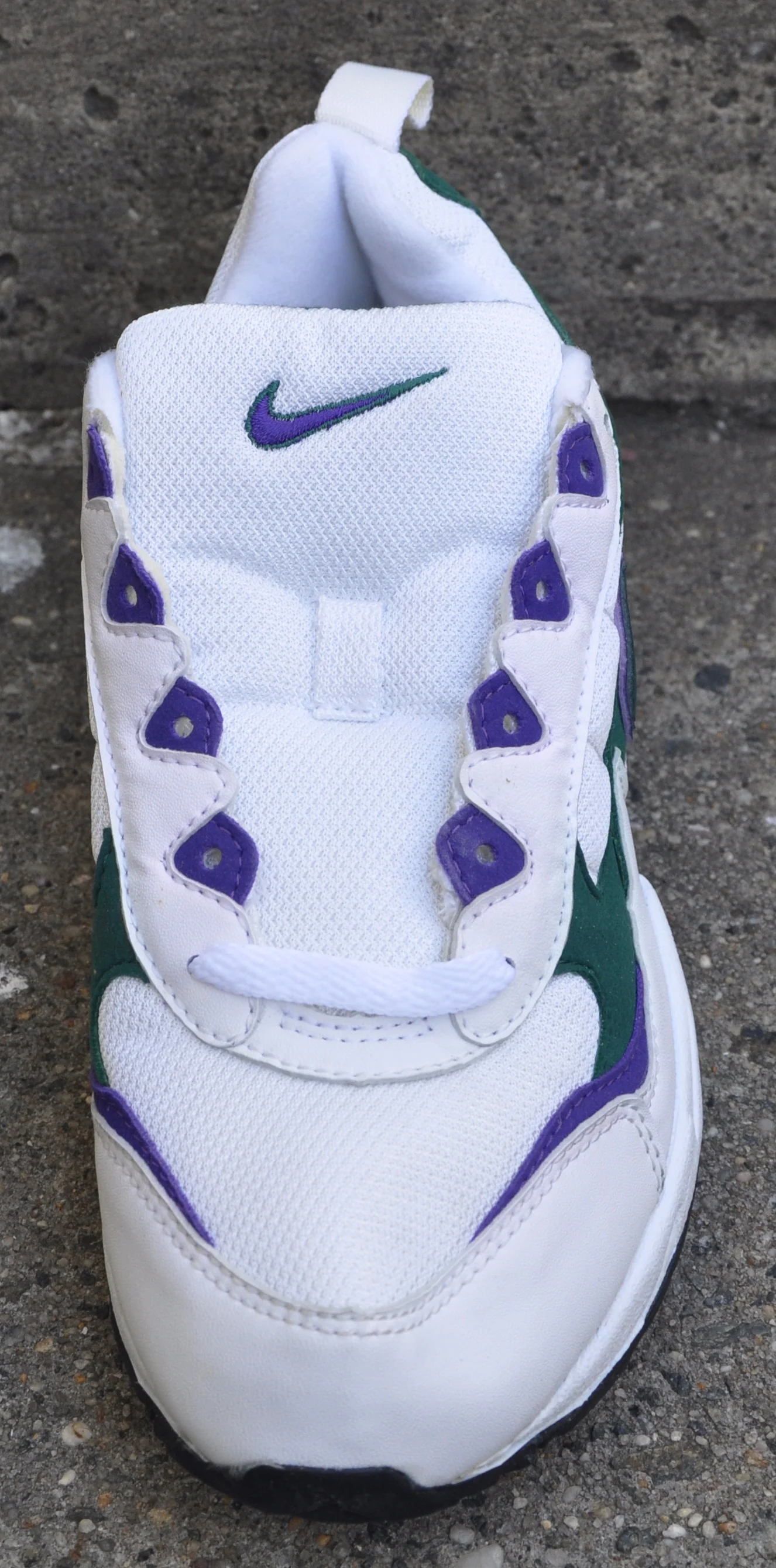 Nike Apprentice white, green, and blue.