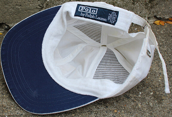 white and blue polo hat