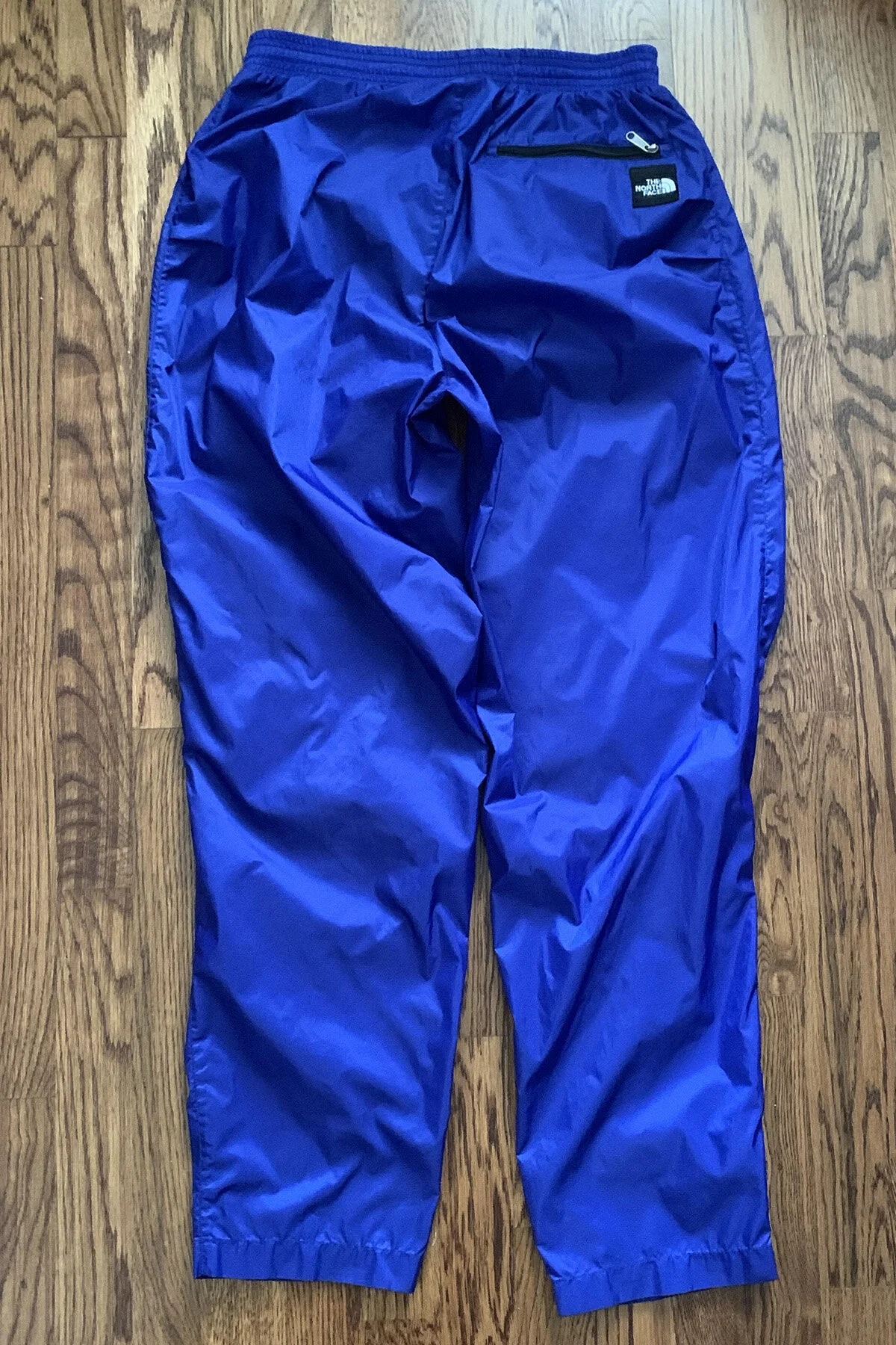 Vintage The North Face Blue And Black Windbreaker pants.