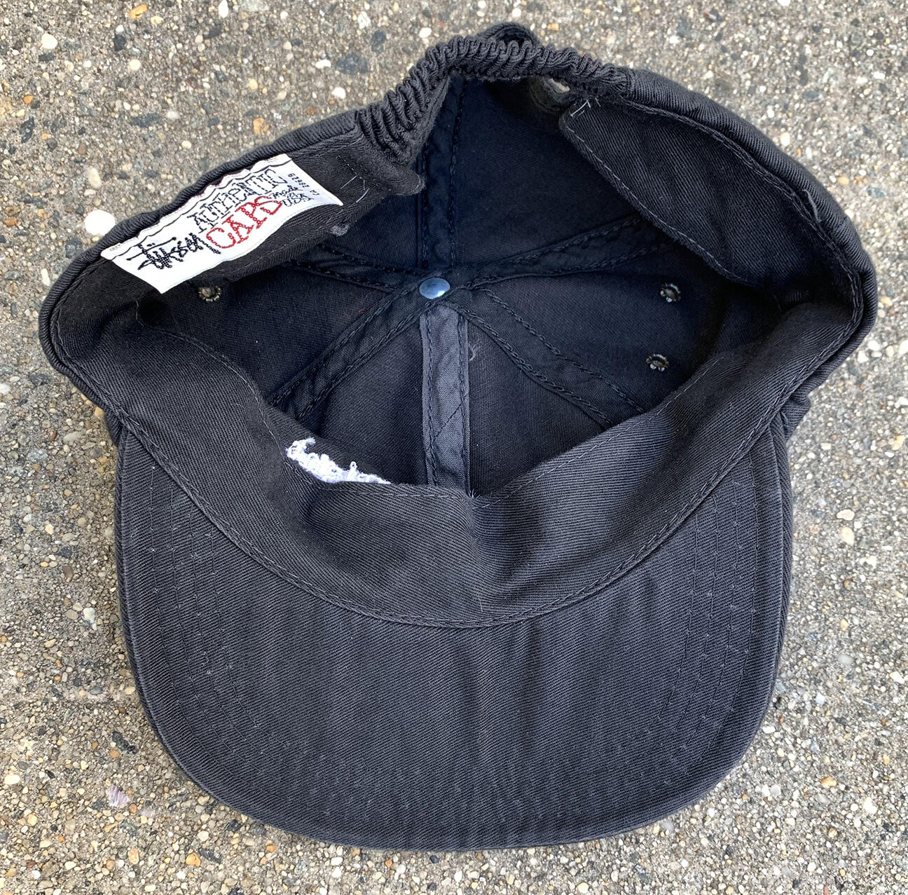 Vintage Stussy Copyright Black Stretchback Hat — RootsBK