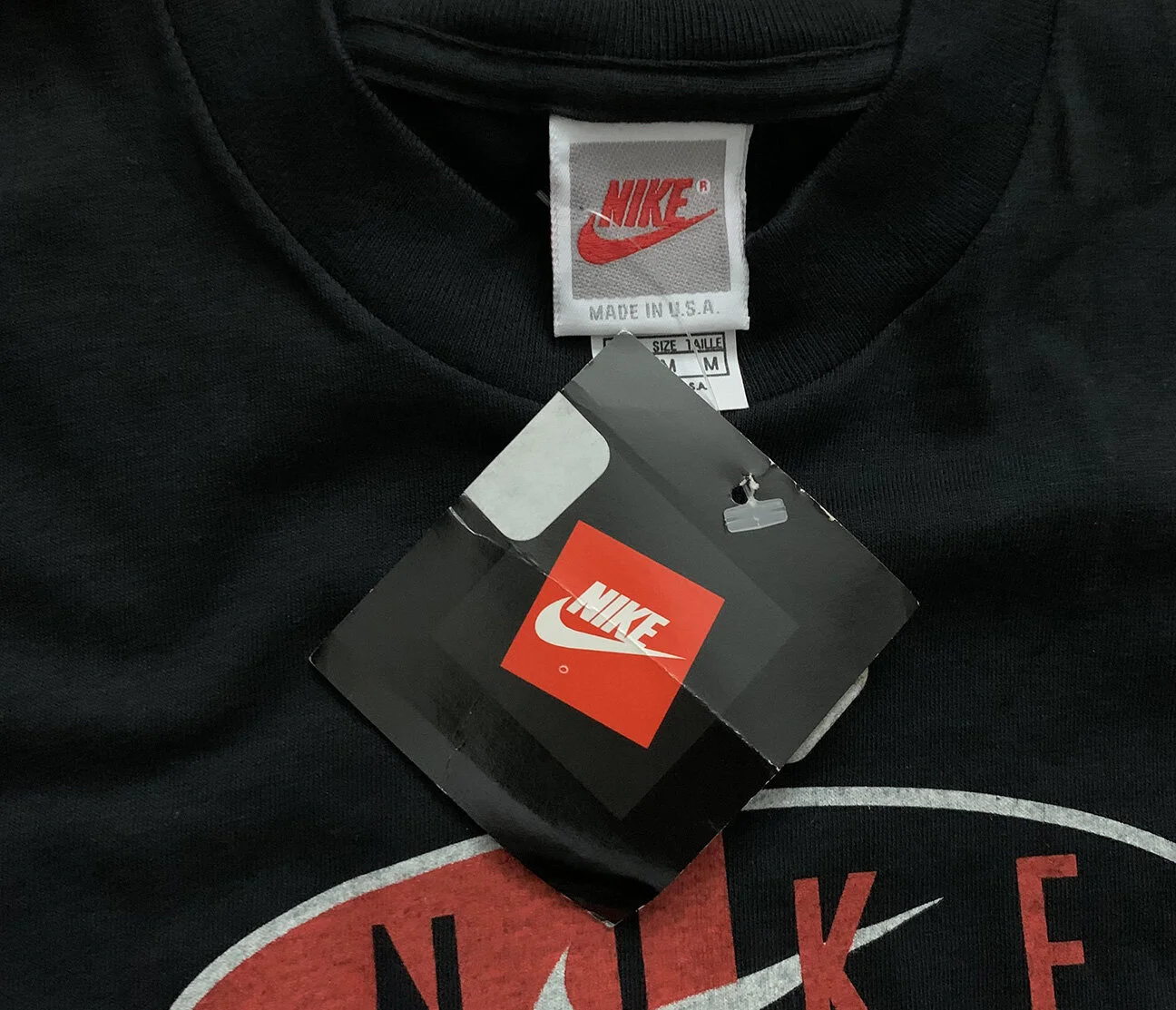 Vintage 90s Nike black and orange t shirt.
