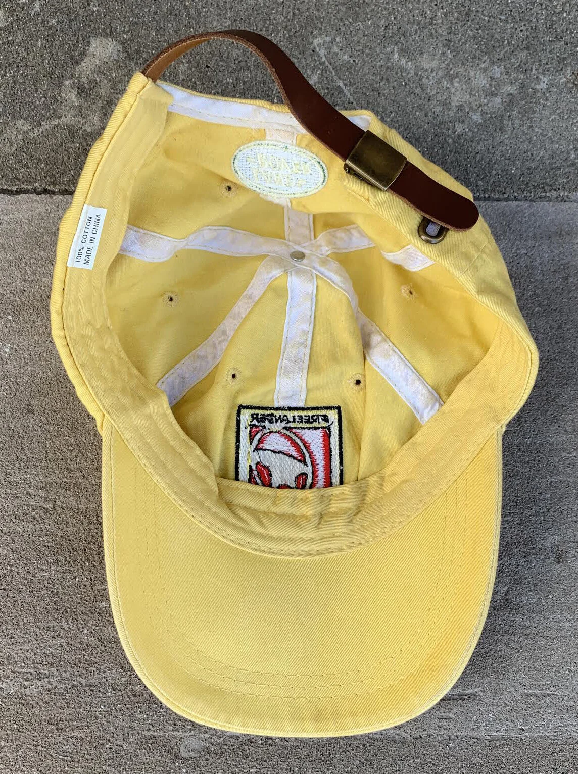 Land Rover Freelander Road To Adventure Promo yellow hat.